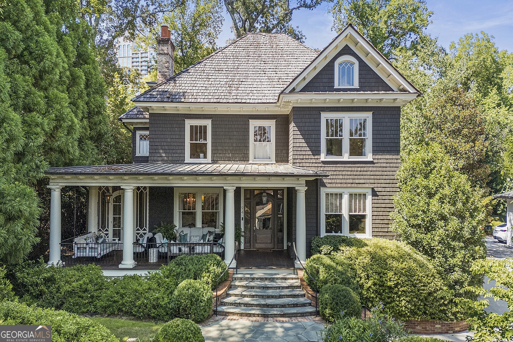 Experience luxury redefined in this exquisitely reimagined masterpiece by Frank Neely, boasting a breathtaking top-to-bottom redesign and renovation. With an unbeatable curb appeal and a private hilltop setting, this historic 100-year-old home retains its old-world charm while offering the modern amenities and floorplan today's buyers desire. The state-of-the-art, open-concept kitchen is a chef's dream, featuring a large island, double dishwashers, high end appliances, a walk-in pantry, and abundant storage and counterspace. The new primary suite is a showstopper with its dedicated sitting room, two designer bathrooms, dual walk-in closets, a laundry room, and a convenient coffee bar. The newly finished third floor offers two additional bedrooms and a bath. along with a versatile flex space currently used as an exercise room. The finished daylight terrace level includes an additional full bathroom, providing even more flex space. The property also features a two-car garage with a finished guest suite above, complete with a kitchenette and full bath. Endless outdoor living options include a charming covered front porch, a screened side porch, and a bluestone rear patio with a cozy fireplace - ideal for entertaining. Truly a one-of-a-kind home where no expense has been spared!