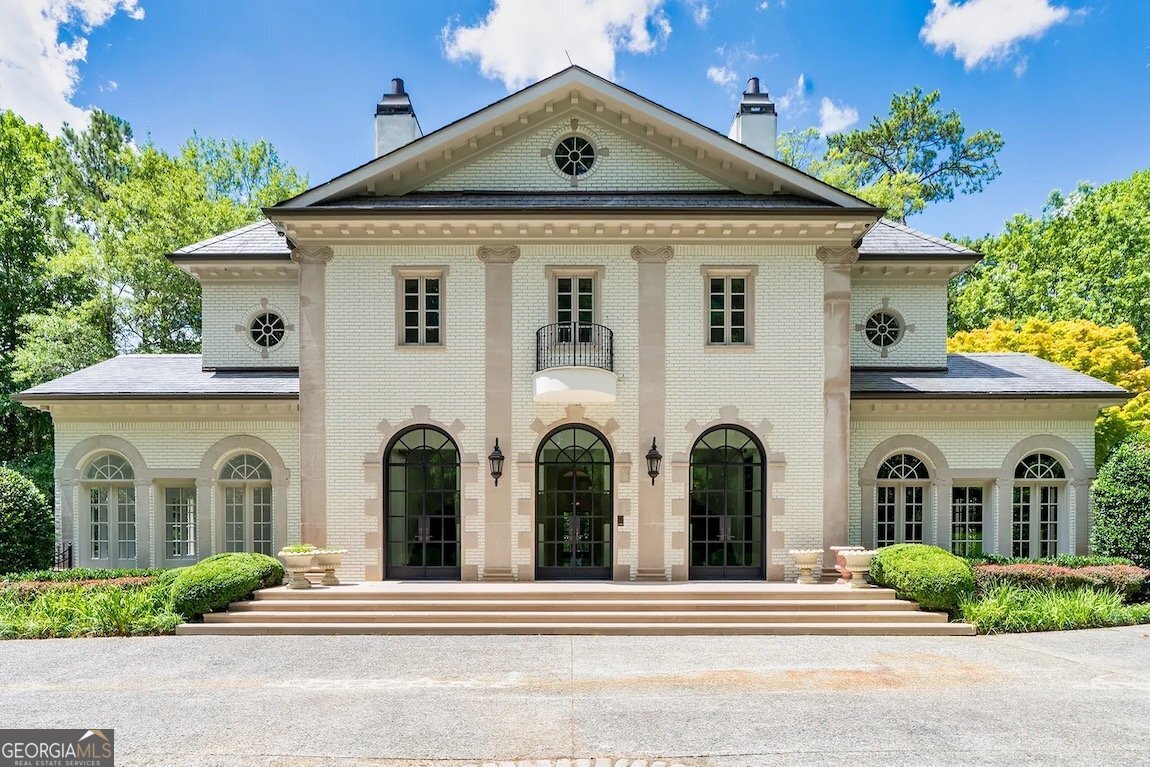 One of a kind home nestled on a private, hilltop lot on 2.3 Acres. The picture of privacy, this traditional, stately home offers 4 finished levels that have been renovated with a greyscale color palate that is modeled after the clean, modern style of LA or Miami. Take in the mature and tasteful landscape as the driveway meanders to the top of the hill and the sire for this estate. Once past the gunite pool and patio, you can enjoy the playground and lighted tennis court. At the top of the driveway, take in the fountain or relax in the gazebo. Pairs of glass and iron doors open to a grand foyer that features a breathtaking staircase and is flanked by 2 living spaces. The details in this home are endless- just stunning everywhere you look. A guest suite with custom closet and full bath are tucked away on the main level. Otherwise, this level is for entertaining! The foyer leads to a formal dining room and then out to the balcony. Adjacent is the stunning kitchen. Rich, dark cabinetry and high contrast honed countertops have stainless details, a raised bar, paneled appliances, separate refrigerator and freezer, 2 dishwashers, and a walk in pantry with custom cabinets and a second refrigerator. Through the mudroom you can step into the attached garage or follow the stairs to a suite above. The second level offers a gallery for displaying personal collections or art, the main laundry, secondary bedroom suite and most importantly, the Owner's suite. This room has been updated with black marble and a bathroom that is magazine worthy, features a fireplace, a morning bar and sitting room. Ascend to the 4th floor where you will find 2 more bedroom suites, each with sitting and a full bath. The terrace level is ready for everything you hope to incorporate. Theatre, full kitchen, 2 bedroom suites, sauna, room for a pool table, access to balconies. the list goes on. Words simply do not do this home justice.