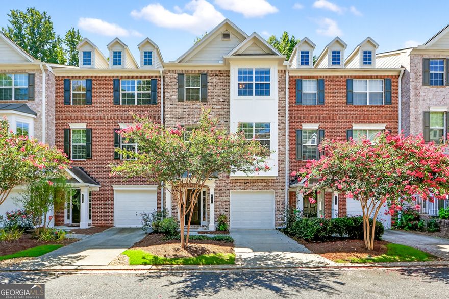 Welcome to this beautifully updated 3-bedroom, 3.5-bath townhome in the heart of Sandy Springs, offering the perfect blend of style, comfort, and convenience. Just minutes from I-285, GA-400, Buckhead, and Midtown, and only a minute from Morgan Falls Park, this location makes commuting and recreation effortless.  Step inside to find an open-concept floor plan with abundant natural light, crown molding, and new oak hardwood flooring that flows seamlessly across the main and upper levels. The spacious kitchen features granite countertops, tile backsplash, ample cabinetry, and stainless steel appliances, opening to the dining and living areas-ideal for both everyday living and entertaining. A rebuilt deck extends your living space outdoors, perfect for relaxing or hosting gatherings.  Upstairs, the primary suite boasts trey ceilings, a generous closet, and a spa-like bath. Secondary bedrooms also enjoy trey ceilings and beautifully tiled baths. Additional updates include new carpet, a new garage door with opener, and a refreshed interior that makes this home move-in ready.  Set within a well-maintained gated community with manicured common areas, this townhome offers both privacy and connection in a prime Sandy Springs location.