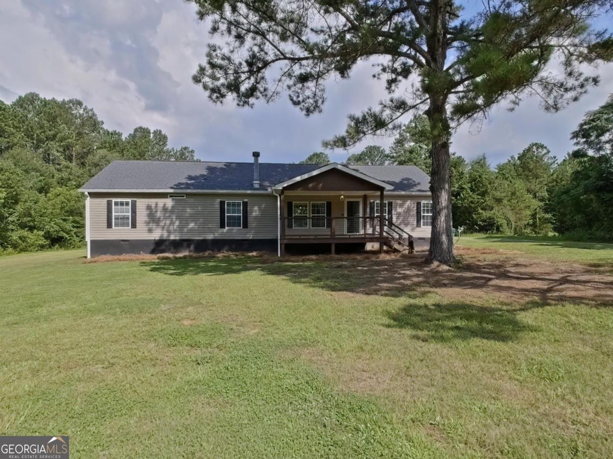 This is not an ordinary home, three acres, two wells and unlimited possibilities. OPEN LIVING SPACE!! Living area has a beautiful fireplace to add ambiance to the setting. The home has hardwood floors throughout. Kitchen is spacious with a farm house sink, pantry and island. Both baths have duel sinks. Main bedroom has a custom walk in closet and a spa like bathroom. Sit on your patio and enjoy the wild life. This home is immaculate. A MUST SEE!! One of a kind!! Move in Ready!!!