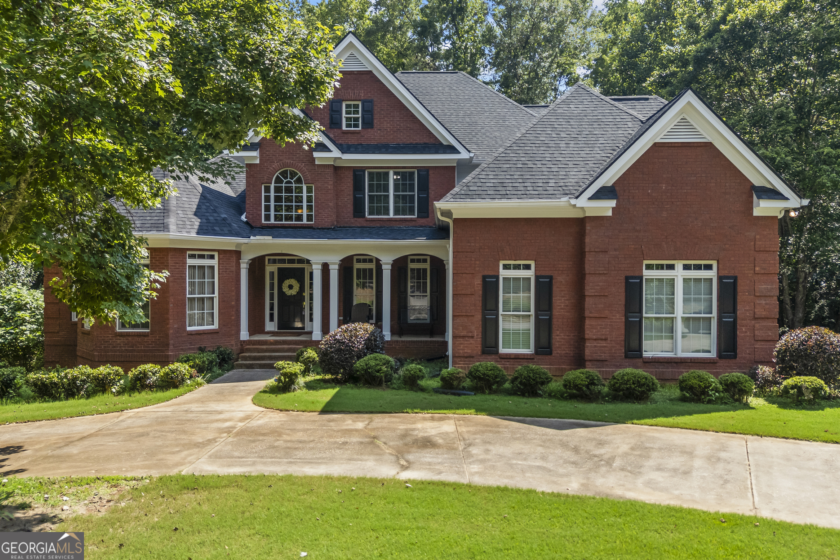 Welcome to this beautifully maintained 8-bedroom, 4.5-bathroom home nestled in the quiet and quaint neighborhood of Chestnut Glen. Offering space, functionality, and comfort, this home is ideal for multi-generational living or those who love to entertain. The main level features an expansive owner's suite with two walk-in closets, a double vanity, a jetted soaking tub, separate shower, and deck access. You'll also find a dedicated office space, a separate formal dining room, and a spacious kitchen with bar seating and a sunny breakfast area - perfect for everyday living on the main floor. Convenience continues with a large mudroom/laundry room, a welcoming front porch, and a back deck that overlooks the peaceful leveled backyard. The finished basement is a true highlight, offering a full in-law suite with three bedrooms, a full kitchen, a workshop, a basement-level patio, and generous storage space. Each bedroom in the home is generously sized, with most offering walk-in closets. Recent upgrades include a brand new roof and three new HVAC systems, ensuring comfort and efficiency for years to come. Enjoy life in a well-maintained home in a small, friendly neighborhood that feels tucked away, yet remains conveniently located.