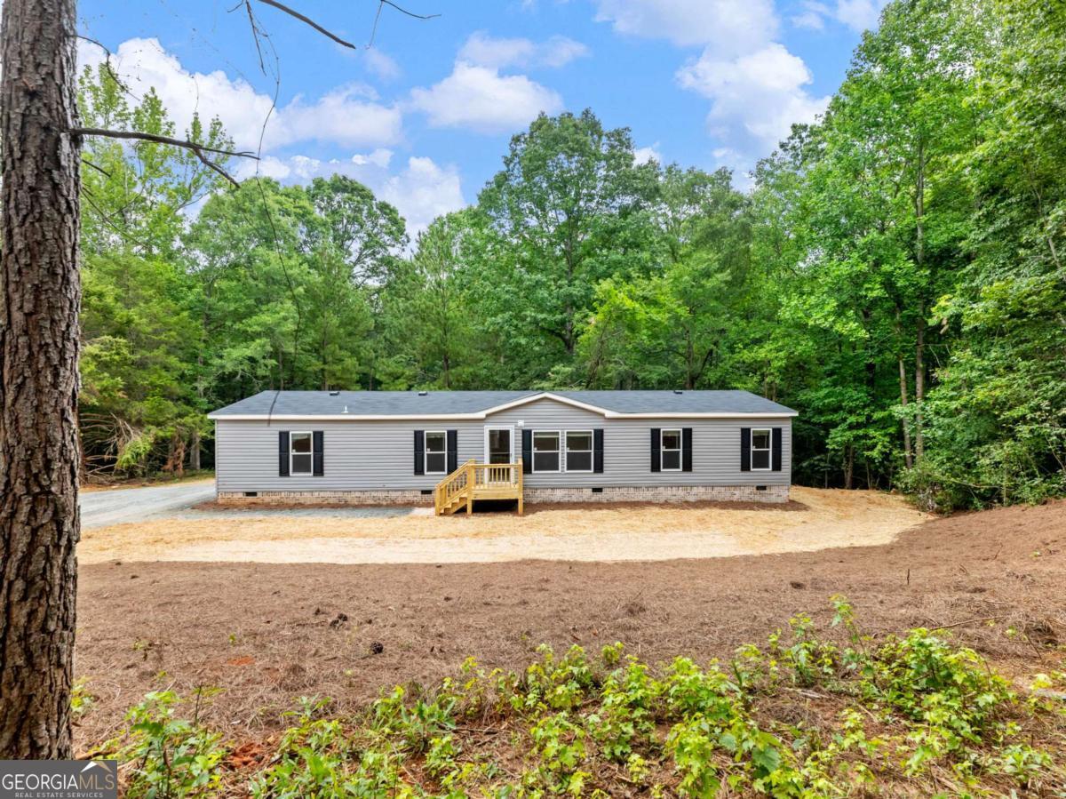 Brand New 2025 Live Oak Home on 2 Acres - FHA Ready! Beautiful new 2025 Live Oak manufactured home on a permanent foundation with brick skirting. This 1,768 sq ft home features 4 bedrooms, 2 bathrooms, and a large back deck-perfect for outdoor enjoyment. Located on 2 acres in Franklin County, the property includes a new septic system and well.