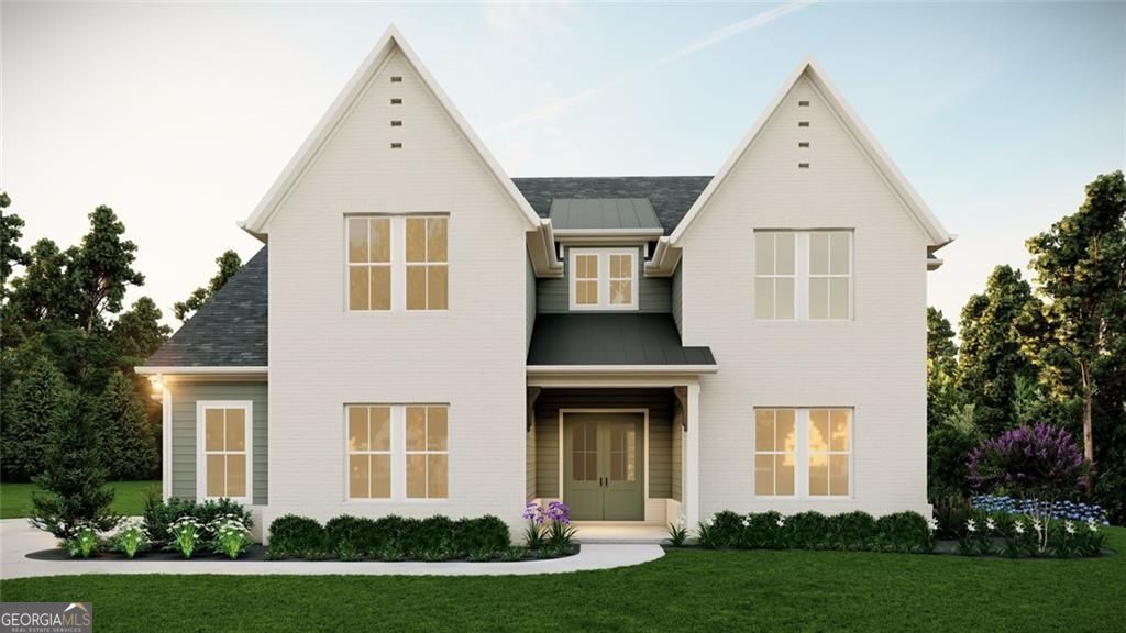 Lot 29, New Construction lake front home on LAKE LANIER (Best Views of the lake in the neighborhood)...includes a deeded covered boat slip at the community dock!!! This home is "to-be-built". Write a contract soon and choose all of the finishes for the home. Will be ready for move-in beginning of 2026. Gorgeous 4 bedroom/4.5 bath/3 car garage plan. Oversized covered back patio with outdoor fireplace is perfect for entertaining by the lake. on the main, study and an additional guest bedroom with private bathroom (with walk-in shower) on first floor. Kitchen with large island, double ovens, stacked upper cabinets, overlooks the great room with a 20' vaulted ceiling! First floor master bathroom has free standing tub in addition to the shower with frameless glass doors. Quartz countertops throughout. Laundry room is connected to the master closet for added convenience. Second floor has an additional 3 bedrooms, 2 bathrooms and a large media/bonus room. Photos are artist renderings of the exterior. Interior photos are of a similar home from the same builder.