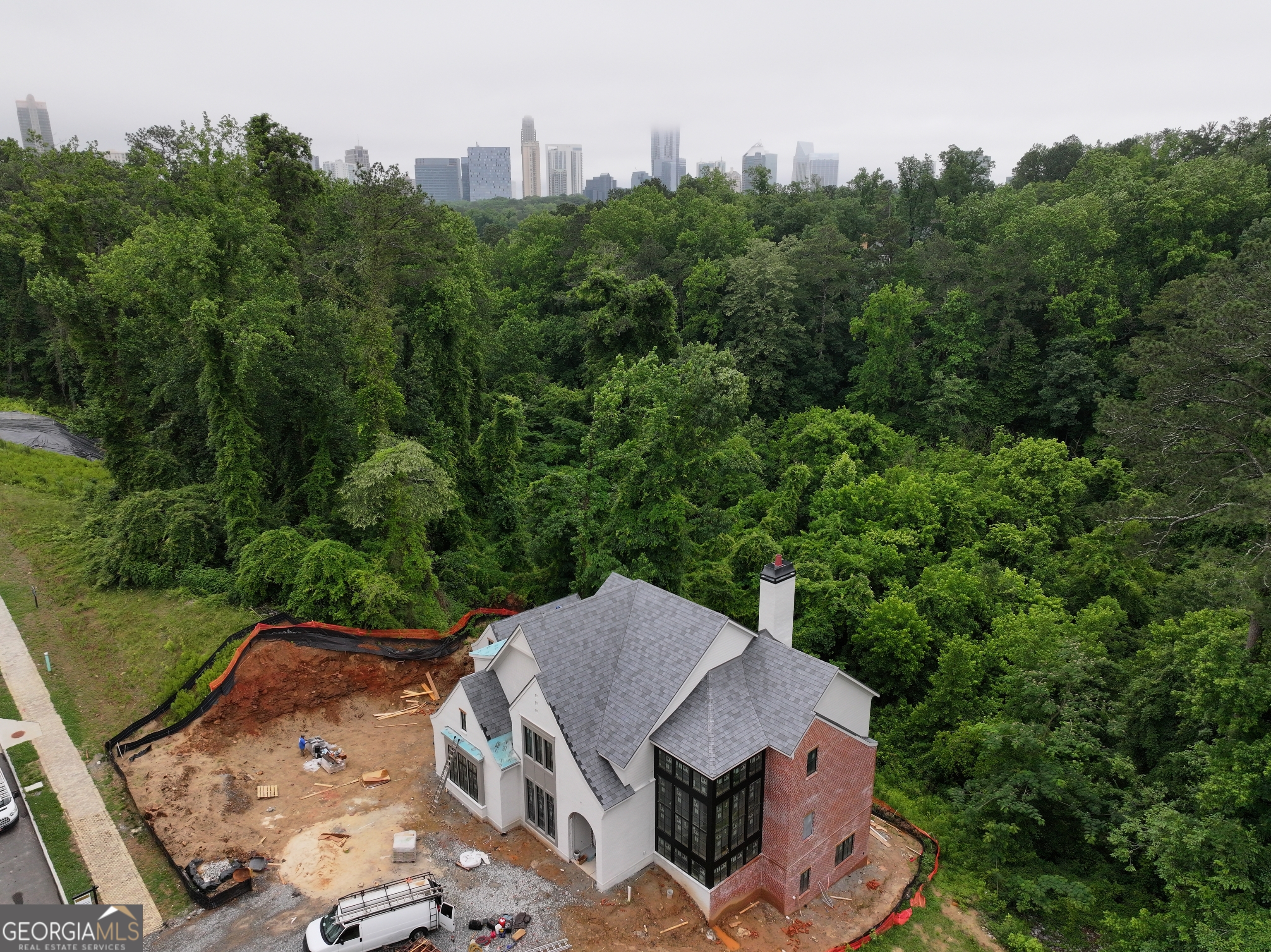 Home to be built. Magnificent luxury home to be built by award-winning Loudermilk Homes in the exclusive and private new 11-home enclave, Blue Heron Walk. The highly sought-after Buckhead location is just minutes to offices, shopping, restaurants, and major highways, yet steps away from the Blue Heron Nature Preserve urban forest featuring 30 acres of natural woodlands and miles of walking trails. This exceptional residence has a modern and thoughtfully designed floor plan with 11 ft ceilings on the main and 10 ft ceilings upstairs, Highlights include 6 en-suite bedrooms with the primary suite upstairs, a guest bedroom on the main level, a guest bedroom in basement, gourmet chef's kitchen, home office, full finished daylight basement, 3-car garage, and a dramatic window-clad staircase bringing the outside in. With light-filled rooms and a covered porch overlooking the changing seasons of the nature preserve, this home is truly built for privacy and the tranquility of nature. Photos and/or renderings are representative, not of the actual property.