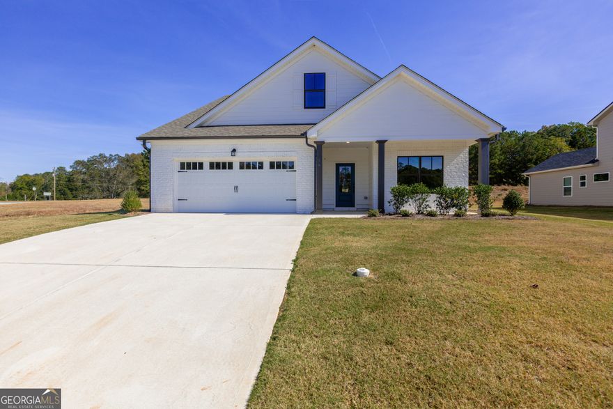 Gorgeous 4BR/3BA New Construction in the Heart of Senoia! The Rivendell floor plan built by Trademark Quality Homes has so much to love and is conveniently located on the multi-use path with direct access to Downtown Senoia. This plan offers 4 bedrooms and 3 baths with a thoughtful, open layout. The owner's suite on the main level includes a spacious bathroom with a double vanity, separate tiled shower, and luxurious free-standing tub. A guest bedroom and full bath are also conveniently located on the main floor.  The chef's kitchen is designed for entertaining, featuring a large island, custom cabinetry, separate cooktop, wall oven, microwave, and a generous walk-in pantry.  Upstairs, you'll find two additional bedrooms, a full bath, and a loft area - perfect for a home office, study space, or cozy lounge.  This home offers the perfect blend of comfort, convenience, and small-town charm.