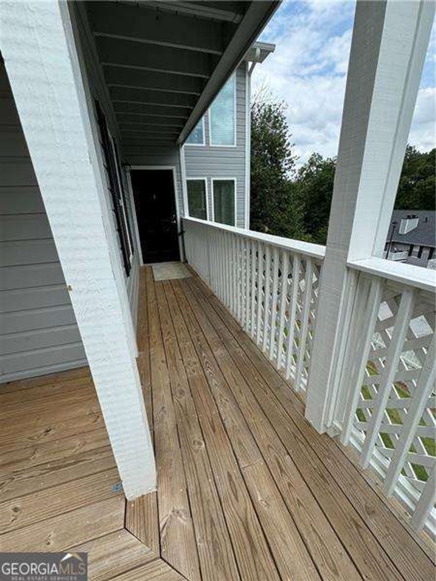 Step into this recently rebuilt, bright and roomy two bedroom, two bath- roommate style condominium situated in the Sandy Springs/Roswell area with easy access to GA 400 and Roswell Rd.  In addition to a living and dining area this unit also has a sunroom which can be used as an office or simply a relaxation room as it is surrounded by floor to ceiling windows along with french doors opening to your private balcony.  This newly re-built unit is equipped with all newer appliances, and beautiful wood shaker cabinets which extend to the ceiling.  This unit also offers hardwood floors, a fireplace in the living room , walk in closets with shelving and new carpet in both bedrooms. This recently built home is move-in ready, showcasing a series of thoughtful renovations, including new double paned windows, fresh paint , and beautiful redesigned bathrooms and cabinetry. The recess lighting in the kitchen, entryway, and living room enhances the ambiance, while the 1 year old AC system and furnace ensures comfort year-round.