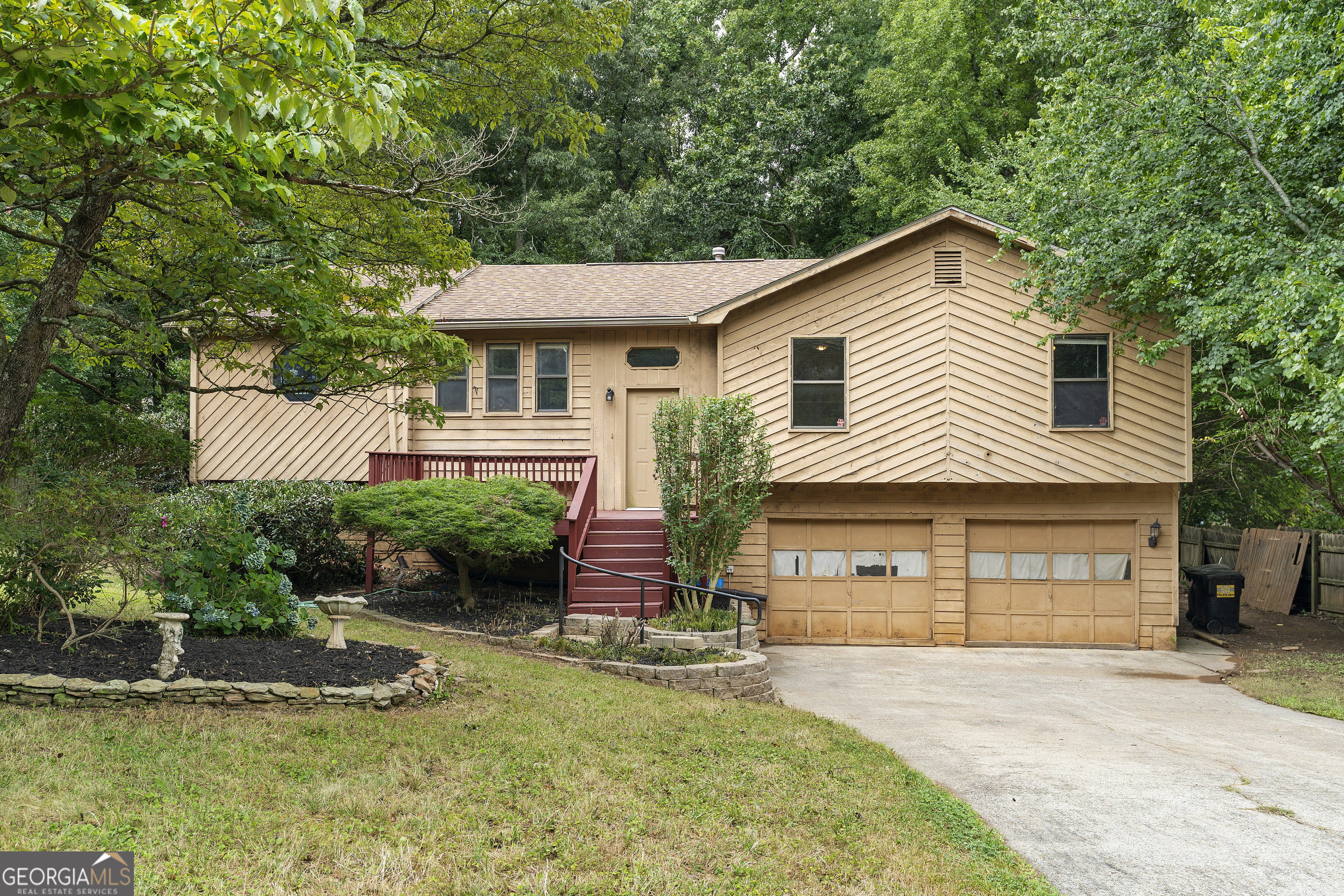Great opportunity in Kennesaw. This 3 bed, 2 bath home needs some TLC, making it ideal for an investor looking for a rental or flip, or a buyer ready to put in a little work. The living room features a masonry fireplace and a breakfast nook. There's a separate dining room and a spacious kitchen. The master suite and all bedrooms are on the main floor. The lower level includes a partial basement and a two-car garage. Both a front and rear deck offer outdoor space-the multi-tiered rear deck is enormous, and with the fenced backyard, it's perfect for relaxing or entertaining.