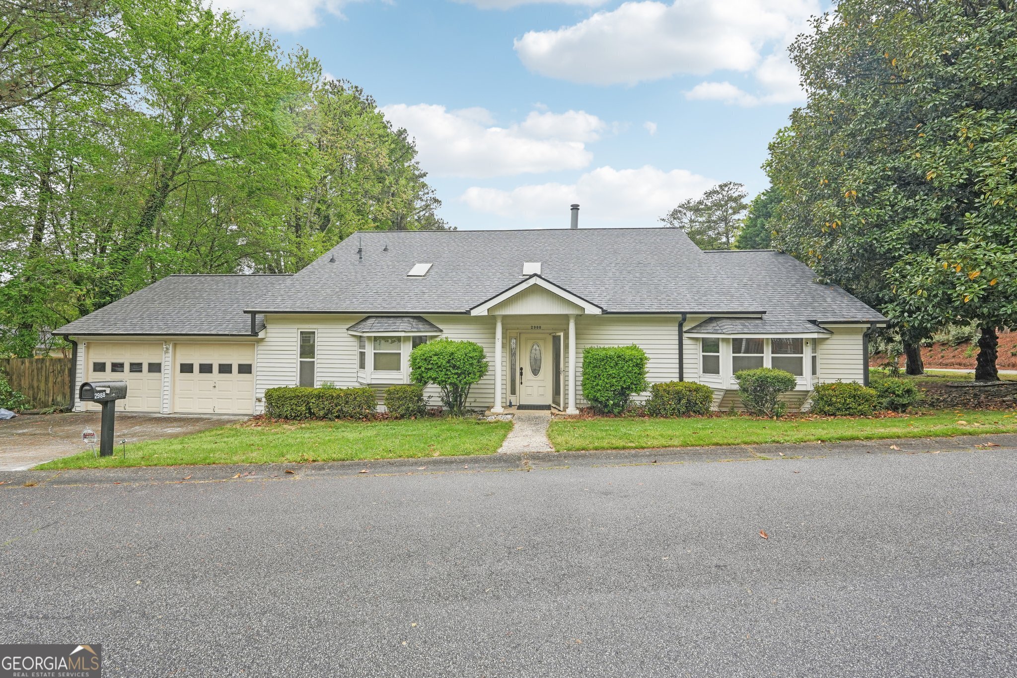 Welcome to your forever home in beautiful Marietta. Just minutes from I-75, The Battery, and Truist Park! Renovated in 2019, this beautifully updated residence offers 4 spacious bedrooms, 3 full bathrooms, and over 3,400 square feet of thoughtfully designed living space. Step inside to find dark hardwood floors and an open-concept layout that seamlessly connects the dining room, family room, and a stunning kitchen filled with natural light from dual skylights. The kitchen features white cabinetry, granite countertops, stainless steel appliances, and plenty of space to entertain or gather. Enjoy cozy nights with not one but two fireplaces, and retreat to your luxurious main-level owner's suite with a spa-inspired bathroom designed for relaxation. Out back, unwind on the oversized porch with a charming gazebo. Perfect for morning coffee or evening cocktails. Located in a private HOA community offering amenities including a pool, clubhouse, and indoor hot tub, this home truly has it all. Zoned for Wheeler High School's acclaimed magnet program and close to Terrell Mill Park, Sope Creek Trails, and Atlanta Country Club Golf Course. A truly fantastic location. Don't miss this rare opportunity to live close to everything while enjoying the peace and comfort of a beautifully maintained neighborhood! The seller will provide a 1-year home warranty and is offering up to 5k in concessions to replace the carpet.