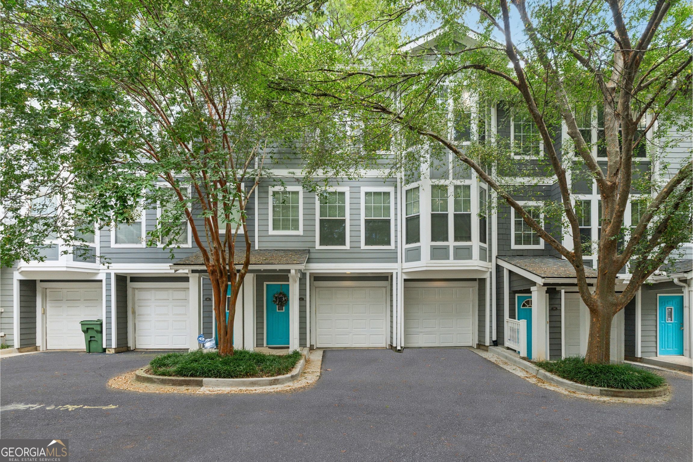 Beautifully maintained 2-bedroom, 2.5-bath townhome in the highly sought-after, gated Grant Park neighborhood-just minutes from the Atlanta BeltLine, Grant Park, restaurants, and shopping. The first level features a 2-car garage with ample storage. The main living level showcases gleaming hardwood floors, an oversized family room with fireplace, and a gourmet kitchen with granite countertops, stainless steel appliances, and a spacious breakfast area. Upstairs, both bedrooms offer walk-in closets and private en-suite baths. The luxurious primary suite includes dual vanities, a separate shower, and a whirlpool soaking tub. Laundry is conveniently located on the upper level. Enjoy low-maintenance living in a prime intown Atlanta location close to parks, trails, and vibrant city amenities.
