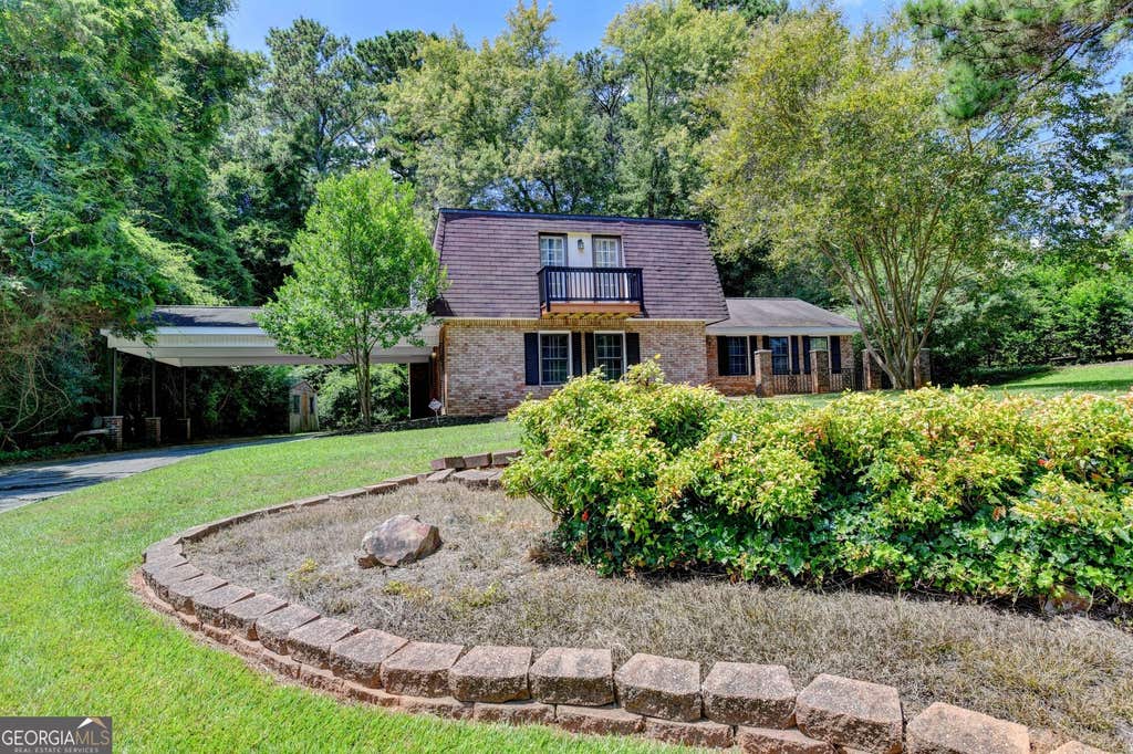 Photo of 567 Planters Row SW, Lilburn, GA 30047 (MLS # 10825226)
