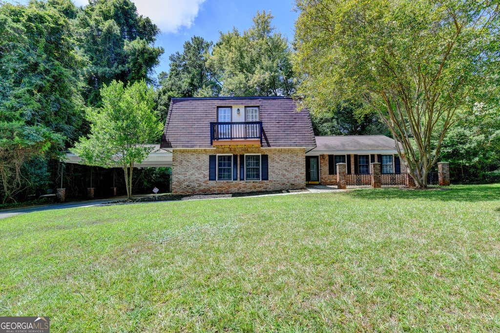 Photo of 567 Planters Row SW, Lilburn, GA 30047 (MLS # 10825226)