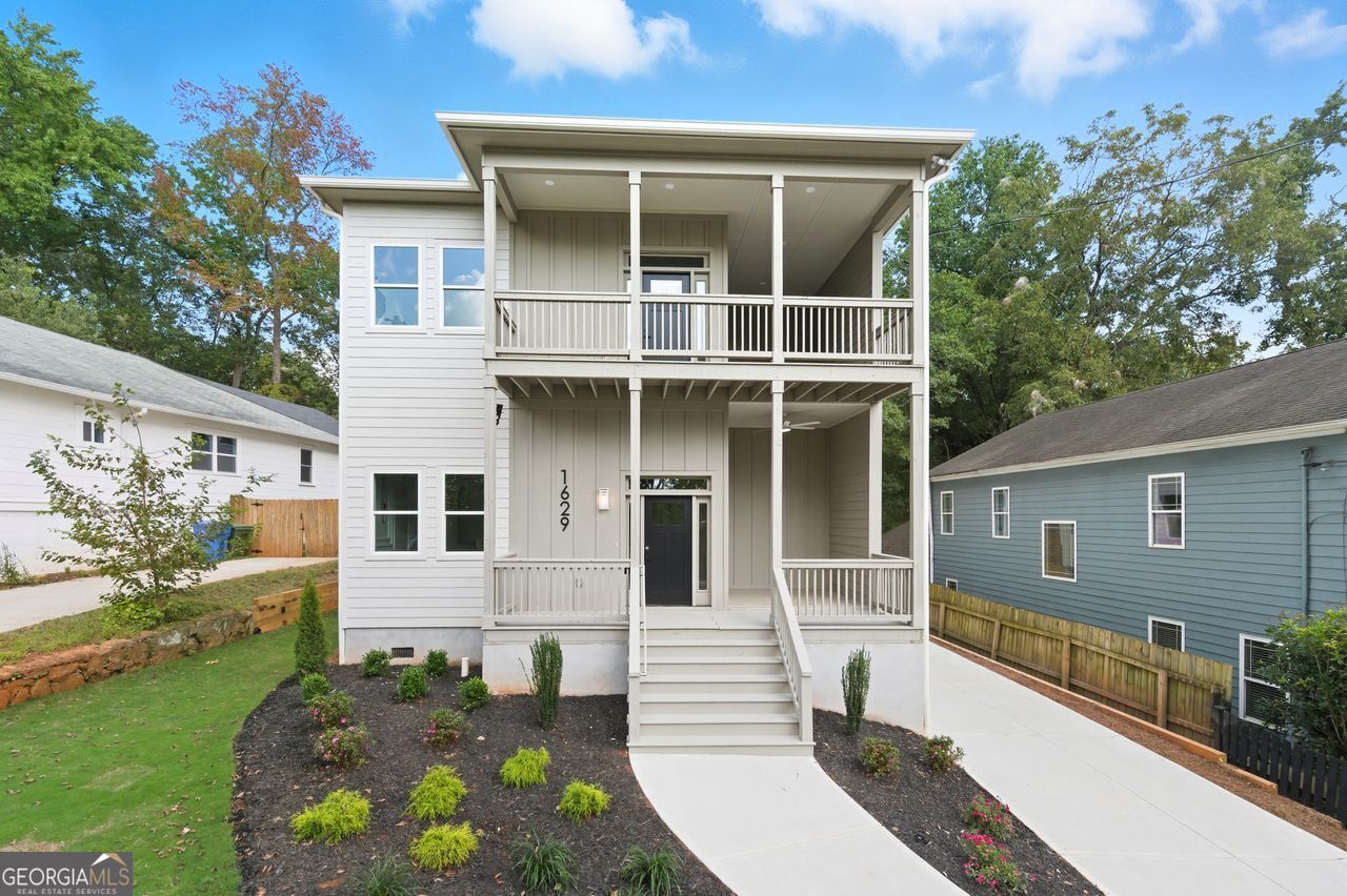 Welcome to your dream home! Brand-new construction tucked away on one of Kirkwood's quietest streets. Life here puts you steps from the Trolley Trail, Kirkwood Dog Park, Coan Park, and all the culture, food, and entertainment that Pullman Yards has to offer. Inside, this home was built to impress. Soaring 12-foot ceilings create a sense of space and light. The chef's kitchen steals the show with its dramatic waterfall island, dual-head sink, WiFi-enabled appliances, and built-in charging stations. A butler's pantry adds function and flair, perfect for hosting. The kitchen flows seamlessly into the large family room, making it the true heart of the home. Your owner's suite is more than a bedroom, it's a sanctuary. Enjoy your private fireplace, morning bar, custom walk-in closet, and covered balcony. The spa-inspired bath invites you to unwind in a deep soaking tub, framed by a massive double vanity. Modern upgrades come standard: an EV charging station, CAT-5 networking throughout, and a sprinkler system for peace of mind. Outdoors, relax on the covered rear deck overlooking your private backyard, or take in skyline views from one of two balconies. This home blends luxury, convenience, and location like no other. In Kirkwood, opportunities like this don't last long.