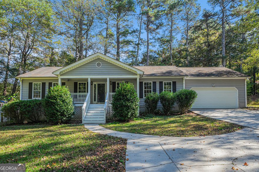 Welcome home to this charming 3-bedroom, 2-bathroom ranch perfectly situated on a peaceful lot in the heart of Auburn.   This home offers the best of small-town living with the convenience of being minutes from Dacula, Winder, and Braselton,   plus easy access to Highway 316 and I-85 for an easy commute.   From the moment you arrive, you'll fall in love with the inviting rocking chair front porch, overlooking the picturesque   creek that runs along the front of the property-a truly serene setting. Inside, a vaulted family room welcomes you with   a cozy fireplace, creating a perfect gathering spot for family and friends.The kitchen features crisp white cabinets, a tiled   backsplash, and stainless steel appliances, and flows into the dining area-ideal for everyday living or entertaining.   The primary suite is privately tucked away on one side of the home and offers a tray ceiling, walk-in closet, and ensuite   bath. Two secondary bedrooms are located on the opposite side, sharing a full bath, perfect for guests or family. The large   laundry room adds extra convenience and functionality to the layout.   Step outside to enjoy the newly built deck, perfect for morning coffee, weekend barbecues, or simply taking in the   tranquility of the private, tree-lined backyard. The 12x16 outbuilding provides flexible space for a workshop, hobby area,   or additional storage, and the extended driveway offers ample parking for guests, a boat, or an RV.   Located inside the City of Auburn, this home offers a rare combination of privacy and proximity to amenities. You're just a   short drive from local parks, schools, shopping, and dining-while still feeling worlds away in your peaceful country-style   setting.   With its charming curb appeal, thoughtful updates, and desirable location, this Auburn ranch is the perfect place to call   home!