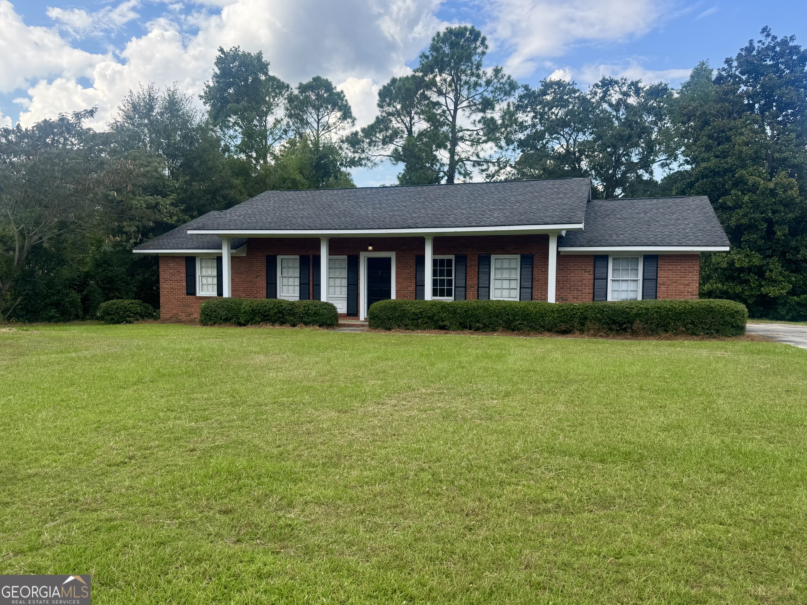 BEAUTIFUL BRICK HOME NEAR SHOPPING AND RESTAURANTS!! This Large Ranch Style Home sits in a popular subdivision close to everything, with 3 Bedrooms/ 2 Baths, Some New Flooring, Tankless Water Heater, Gorgeous Built Ins, a Woodburning Fireplace in the Dining Room, an Oversized Yard with Mature Landscaping, and Updated Roof. Call to Schedule a Tour!