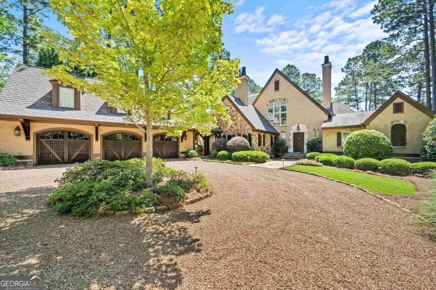 Extraordinary Custom-Built Waterfront Home in Reynolds Lake Oconee offering the combination of thoughtful design and unparalleled materials & craftsmanship throughout its 5400+ Square Feet. This 5 Bedroom/4 Full & 2 Half Bath Home is situated on an incredibly private Estate Lot with huge main lake views and it's also just a short walk from The Lake Club, The Marina and The Ritz-Carlton. The location could not be more ideal. Inside you will find a flowing floor plan with extensive windows, doors and patios that take in the amazing lake views and the incredible resort style pool. On the main level a spacious Master Bedroom & Bath has been updated along a renovated Chefs Kitchen so don't let the age of the home fool you as it's move in ready. Also enjoying a beautiful Study on the Main Level, you have all you need for one level living but when the family & friends visit, the additional 3 Bedrooms in Upper Level along with a Guest Suite over the 3 Car Garage, you will have all the elements you need for Family Living & Grand Entertaining. This great lake home is impressive yet comfortable and it must simply be seen to be appreciated. Seller is making a Club Membership available.