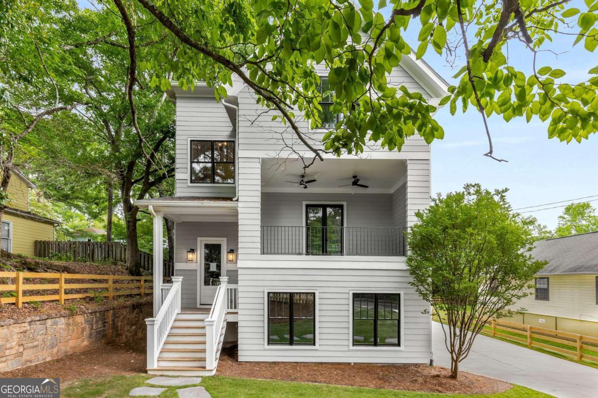 FINAL OPPORTUNITY-SPECIAL BUILDER PRICING! Seize your last chance to own the only remaining home in Ormewood Commons, a boutique 5-home community in Historic Grant Park, steps from the Beltline, Grant Park & Zoo Atlanta, and favorite local dining and shops. This 3-level residence pairs refined design with modern convenience, offering bespoke million-dollar-plus finishes that deliver unbelievable value rarely found at this price point. From site-finished hardwoods and hand-selected Visual Comfort lighting to the chef's kitchen with custom cabinetry, pro-grade appliances, striking vent hood, and oversized island, every detail impresses. The first-level suite with private entry is perfect for guests, in-laws, home office or income-producing AIRBNB, while the fireside living room and covered loggia create seamless indoor-outdoor living. Upstairs, the owner's retreat offers a spa-like bath, with two additional bedrooms, full bath, and laundry nearby. Outdoors, enjoy a fenced yard and community fire pit framed by a century-old stone wall. With unmatched design, walkable access, and a value that cannot be duplicated, this rare final home won't last-now is the time, don't miss your moment!