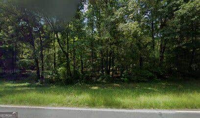 Photo of 165 Log Cabin Road NE, Milledgeville, GA 31061 (MLS # 10823654)
