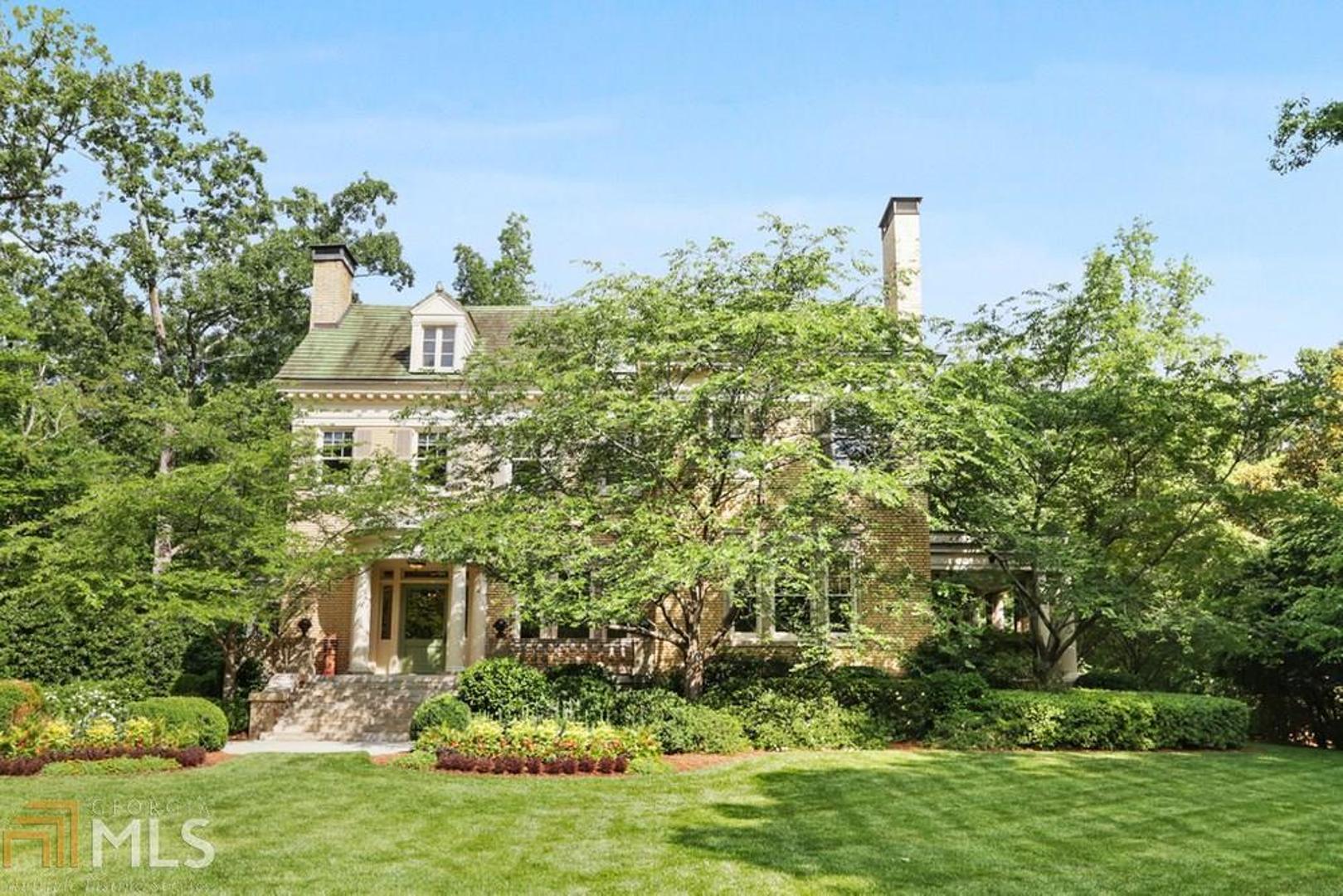 Designed by noted architect Neel Reid in 1918, Rest Haven was built for William Candler, youngest son of Coca-Cola founder Asa Candler. Set on two sprawling acres and completely surrounded by mature landscape, this home offers valuable privacy and a remarkable opportunity for the discerning buyer. Thoughtfully renovated to incorporate today’s modern amenities while carefully preserving the history and historic character, this home boasts 12’ ceilings on the main, generous formal living and dining spaces for entertaining , a separate and private side porch off the dining room, a large, open kitchen family room with abundant natural light a fireside den and an additional, fireside office off the family room. Up the grand staircase to an additional, sitting area, a generous owner's suite and three additional bedrooms and full baths. The three-car carriage house hosts a large entertaining and living space along with a private porch, bedroom and full bath. Beautifully situated in the neighborhood with easy access to Emory and the Druid Hills Golf Club, Rest Haven is a special piece of history that is not to be missed.