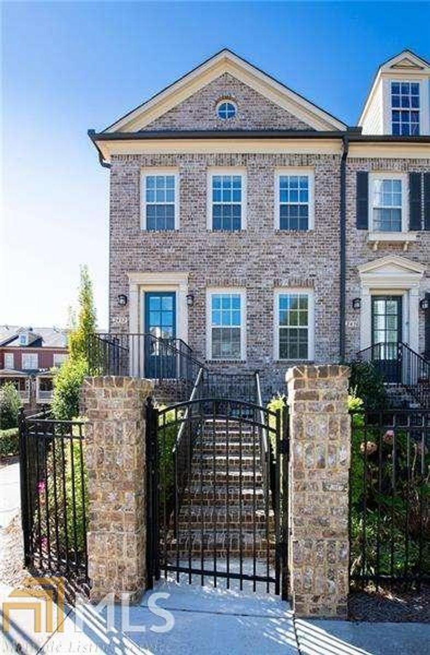 Gorgeous move-in ready John Weiland built townhouse in sought after Turnbury Gates community!  The home features an open floor plan, 10' ceilings, hardwood floors throughout, granite countertops, multiple built-ins, and a large deck. On the main floor is the large kitchen with a separate breakfast area, dining space, fireside Family room, bonus room, and half bath. Upstairs is the ownerG??s suite with dual vanities, tub, separate shower, and large walk-in closet. Additional big bedroom, full bath, and laundry room complete the upper level. The lower level of the home is an additional bedroom and full bath, and the mudroom leads to the oversized two-car garage. Zoned HVAC for each floor. The Gated community features grassy areas for play, an outdoor fireplace w/ seating, pool, clubhouse & guest parking. 0.2 mi to Wholefoods, shopping & more. Minutes to Brookhaven, Buckhead, and Perimeter.