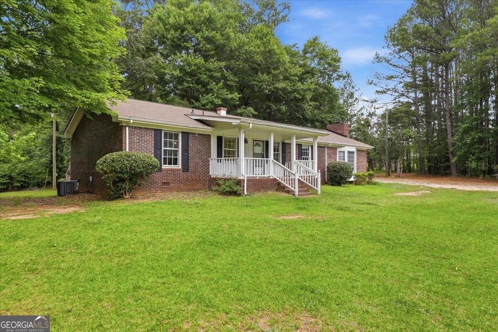 Photo of 1009 Highway 85 S, Fayetteville, GA 30215 (MLS # 10872348)