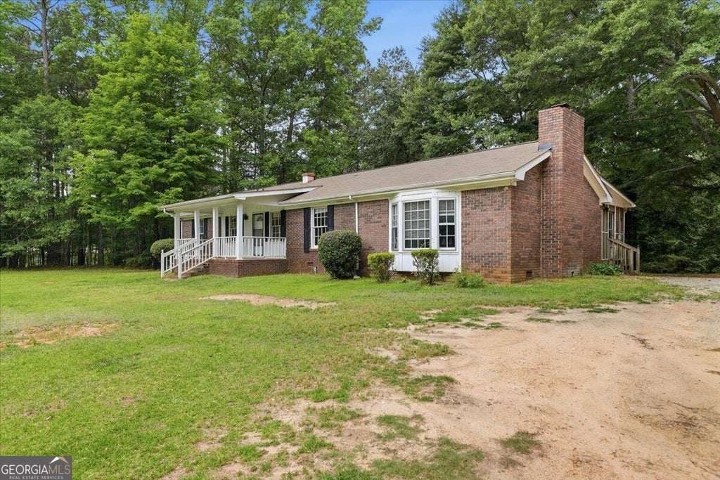 Photo of 1009 Highway 85 S, Fayetteville, GA 30215 (MLS # 10872348)