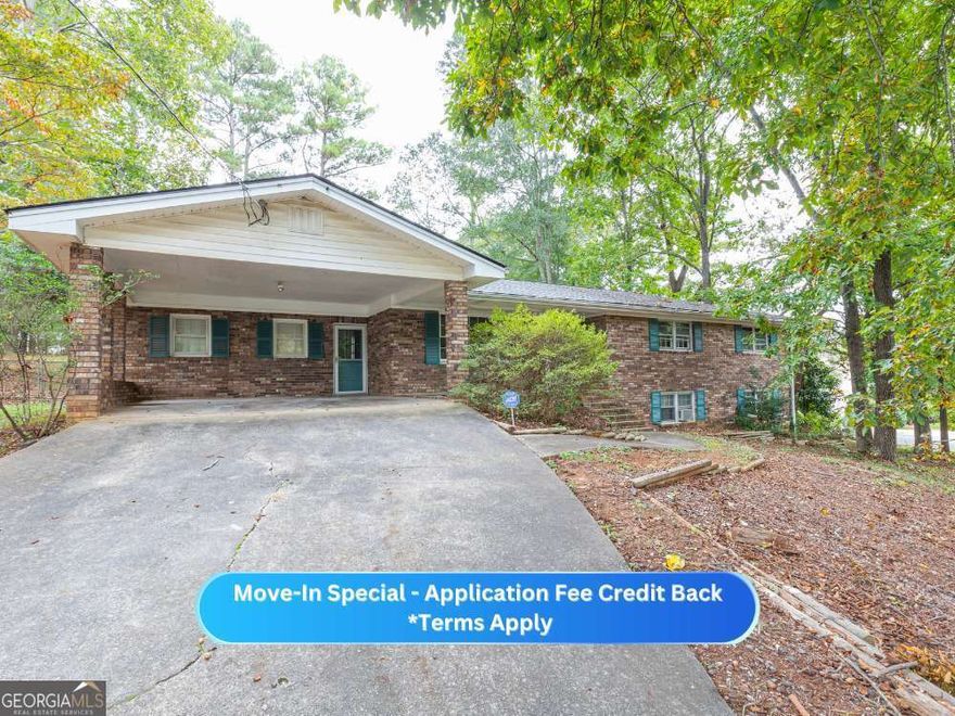 APPLICATION FEE CREDIT BACK TOWARDS RENT IF LEASED BY 11/1/25 -        Experience stylish living in this beautifully renovated 3-bedroom, 2-bath brick home, ideally situated on a spacious corner lot. Enjoy the convenience of a full basement and a 2-car carport, providing both comfort and practicality.        Step inside to find elegant flooring and fresh, modern paint throughout. The updated eat-in kitchen is a chef's dream, featuring stainless steel appliances, sleek quartz countertops, a breakfast bar, and abundant cabinet and counter space, plus a cozy dining area perfect for meals.        Host unforgettable gatherings in the generous family room by a decorative fireplace, relax in the separate living room, or savor the outdoors on your back patio overlooking a large, fenced backyard ideal for entertaining or unwinding.        The primary suite offers a walk-in closet and a private bath with a tub/shower combo. 2 additional bedrooms are well-sized and share a full hall bathroom, which also includes a handy laundry chute.        A full, unfinished basement provides endless potential for extra storage, a workshop, or customized bonus space to fit your needs. This move-in-ready home is the total package.        Situated in a prime location, you're just minutes away from shopping on Barrett Parkway, Town Center Mall, the Woodstock Outlet Mall, and have easy access to I-75 and I-575. Plus, you're in close proximity to Kennesaw State University, Marietta Square, Downtown Kennesaw, Downtown Woodstock, and much more. Don't miss out on making this beautiful house your new home!        This property is eligible for deposit alternative coverage in lieu of a security deposit. Eligibility requirements apply. For details and enrollment, please contact our leasing team and enjoy a deposit-free renting experience!        Specialized Property Management residents are enrolled in the Resident Benefits Package (RBP) for $42.00/month which includes tenant legal liability insurance, HVAC air filter delivery (for applicable properties), credit reporting, renter rewards program, and much more!