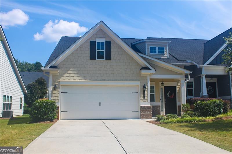 This charming end-unit townhome offers a spacious and functional open floorplan designed for comfortable living. The main level features the master suite along with a secondary bedroom and full bath, while the upper level includes a versatile loft, an additional bedroom, and another full bath, ideal for guests or a home office. Expansive windows across the back of the home fill the living areas with natural light. The kitchen is appointed with white cabinetry, stone countertops, stainless steel appliances, and a refrigerator that remains with the property. Main floor laundry room with washer and dryer included provides added convenience, and the screened porch offers a relaxing outdoor retreat. Situated in a highly desirable location, the home is just minutes from shopping, dining, KSU, and the historic charm of Downtown Acworth, Downtown Kennesaw, Woodstock, and Marietta Square. This low-maintenance residence is move-in ready and available for a quick close.