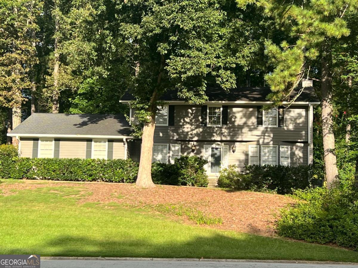 Coming Soon - LOCATION, LOCATION, LOCATION!! Come home to this great 4 bedroom, 2.5 bath family home in the ideal location combining Marietta City Schools & Marietta City Services with the recreational opportunities at Fair Oaks Park. Multiple points of entry and egress into the neighborhood will help calm the stress of an early morning or late afternoon commute. The traditional floor plan features a living room, dining room, kitchen, and den, making entertaining easy. There are multiple ways to occupy the room off the kitchen either as a cozy den, an office, or even a playroom. The large laundry room has natural light and an exit to the enclosed garage, making it perfect for a true mud room. Up the wide staircase, you will find 4 bedrooms with a central bathroom accommodating three of the four. Two of these bedrooms offer double closets. The master bedroom also features double closets as well as its own private bathroom. Find solace when you retreat to the private, wooded backyard that is part of this deep lot. Enjoy morning coffee on the back patio surrounded by nature! The architectural shingle roof has tons of life left and much of the interior has fresh paint. Come see this great home in a well-established Marietta neighborhood today!
