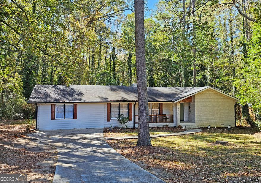 Located on 1,5 Acres, this home presents an exciting opportunity to establish your roots in a desirable location and holds timeless appeal as it has been recently updated. Within this single-family residence, you will discover four bedrooms, each providing a private retreat for rest and rejuvenation. With 2400 square feet of living area, there is abundant space for various activities and comfortable living. The property further benefits from three bathrooms, offering practicality and convenience for all occupants. All Bedrooms are spacious, and all Baths are Updated with the Master Bathroom making you feel like you are at a luxury hotel.  Gorgeous open concept Family room and Kitchen offers a ton of space, newer stainless steel appliances, a breakfast bar and features two dining areas, with one on each side of the kitchen. Easy access to covered back porch from kitchen allows you to truly enjoy the peace and quiet of your enormous retreat and backyard, or Entertain or bbq.  Did I mention that home is just a hop and a skip to one of Fulton County's best Parks, a 10 minute drive to Hartsfield International Airport, and just a 5 minute drive to Camp Creek Marketplace where there are a ton of restaurants and shops? This Atlanta home awaits your personal touch to transform it into a haven perfectly tailored to your lifestyle. It won't last long at this price or location!