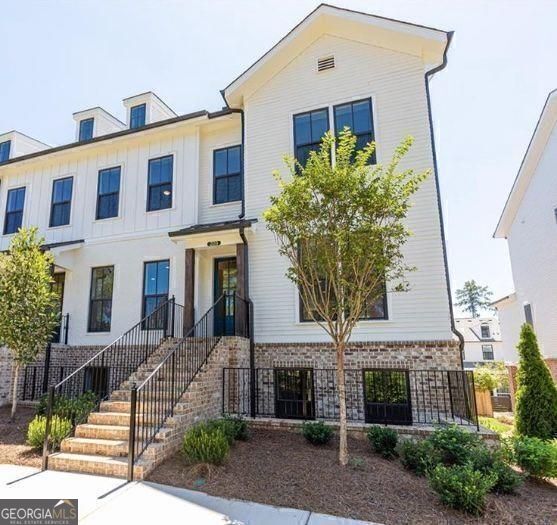 Discover the epitome of upscale living in this stunning townhome, nestled perfectly between the Avalon shopping district and Downtown Alpharetta City Center. Enjoy the finest in dining, boutique shopping, free concerts, food/music festivals and seasonal farmer's markets, all within easy reach. Nestled in the prestigious sought after gated Chelsea Walk community, this stunning end-unit three story townhome offers the perfect blend of privacy, luxury and convenience, with a large fenced dog park, private pocket park, and direct and secure access to the Alpha Loop. This townhome offers plenty of natural light, 3 bedrooms, 3 and 1/2 baths, and over 2,500 square feet of luxurious living space. The open floor plan seamlessly connects the kitchen, family room, and sunroom/office creating a spacious and inviting atmosphere. The gourmet kitchen features stainless steel appliances, upgraded white cabinetry, large island, stone countertops and a sleek open design perfect for hosting gatherings. The oversized primary bedroom provides a serene retreat, complemented by a spa-like master bath with upgraded oversized frameless glass shower and spacious custom closet. Two generously sized secondary bedrooms offer ample closet space and each have their own full ensuite bathroom. It also offers a private deck, three extra large storage closets, fireplace, powder room on main, laundry on upper, HOA maintained landscape and lawns, and an unbeatable location with under half a mile walk to both Downtown Alpharetta and Avalon. Don't miss this opportunity!