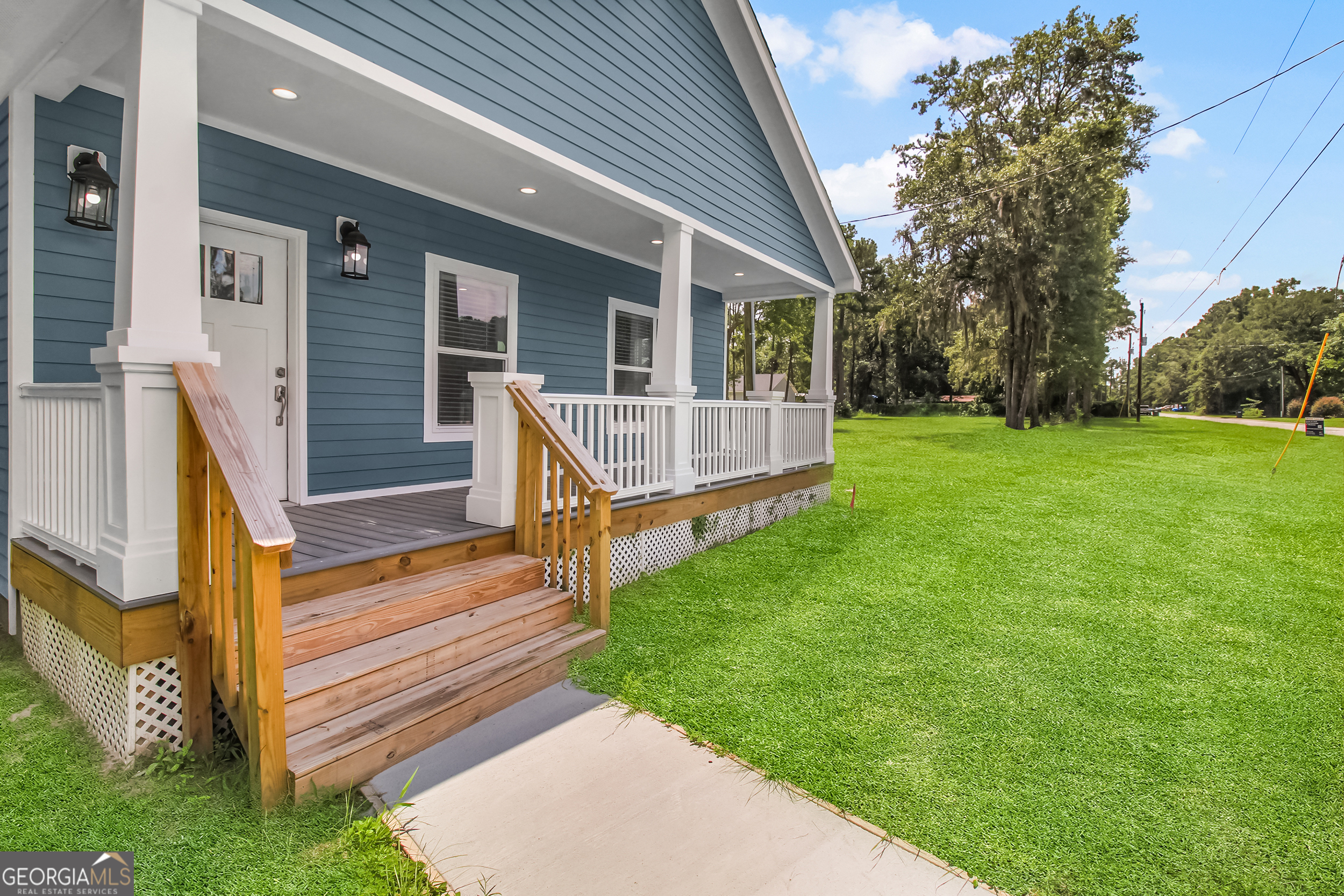 Welcome to 19 Pecan Street in the City of Ludowici, GA. Located only 25 minutes from Fort Stewart and Hinesville, this high finish bright open concept floor plan home is the perfect spots to call home. The house has 9' ceilings, crown molding and luxury vinyl plank floors throughout. The open living room and kitchen are perfect for entertaining. The kitchen features granite countertops, all stainless steel appliances (refrigerator included), and an area suitable for a full size dining table. The owner's suite features a walk-in closet, an en-suite bathroom with double vanities and lots of daylight. A large mudroom/laundry room is centrally located with a side entrance to the home between the two additional bedrooms. Built with all Hardie board siding, composite decking, energy efficient systems, windows, insulation and appliances, maintenance on this home will be exceptionally simple! This home comes with a FOUR-YEAR HOME WARRANTY, and the roof is rated to withstand hurricane force winds of up to 140 miles per hour. No HOA! This is Modular Construction built partially in a controlled environment by Impact Housing in Baxley, GA out of high quality materials. This home qualifies for 100% Financing through VA, FHA and Conventional Products. This is also a Georgia Dream and USDA Compliant home!