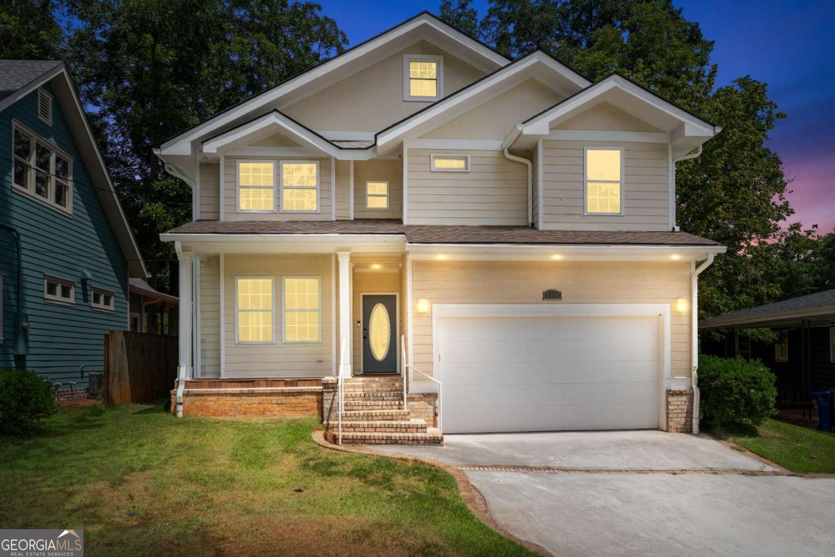 Convenient to I-20, nestled off Memorial Drive, this 3000+ square feet Parkview home embodies quiet, city living. Enter through the marble-floored, sun-filled formal living and dining space before falling in love with the chef's kitchen equipped with custom cabinetry, granite countertops, an expansive pantry and Viking appliances including a double oven, oversized gas cooktop and wine cooler that opens directly to a spacious living room perfect for entertaining or lounging with family. Up the grand foyer staircase you will find two primary suites, each with private bathrooms. The first boasting marble throughout with separate vanities, a walk-in shower and jacuzzi tub. Two additional bedrooms utilize the third full bathroom near the easily accessible laundry room with ample storage all on the same level. Back downstairs, Continue to entertain loved ones in the bonus theatre room or the brand new oversized deck overlooking the private backyard. You will never run out of storage with the two-car garage and massive attic space. Full roof replacement in 2021, new HVAC 2023. Just minutes from downtown Kirkwood, East Lake Golf Club, sought after Drew Charter School, East Atlanta Village and more, this home is the epitome of classic, luxurious intown living. Located just blocks from DeKalb Memorial Park and Disc Golf, Charlie Yates Golf Course, you have the best of intown living with the comfort and charm of a true neighborhood gem. Minutes from Kirkwood Village, East Atlanta, Pullman Yards and Little Five, don't miss this delightful opportunity to live in one of Atlanta's most "happening" neighborhoods! It's walkable and culturally rich and you're minutes from the Beltline, Pullman Yards, East Lake Golf Club, and some of the city's finest restaurants, boutiques, and green spaces. Situated in a peaceful neighborhood with a spacious backyard, This property is a true urban oasis, seamlessly blending luxury and accessibility into a remarkable design and trim package. Just a short walk to Dekalb Memorial Park, Bessie Branham & Coan Park, where amenities cater to every age, making family outings both effortless and memorable. Come explore your gateway to a lifestyle of convenience, comfort, and luxury.