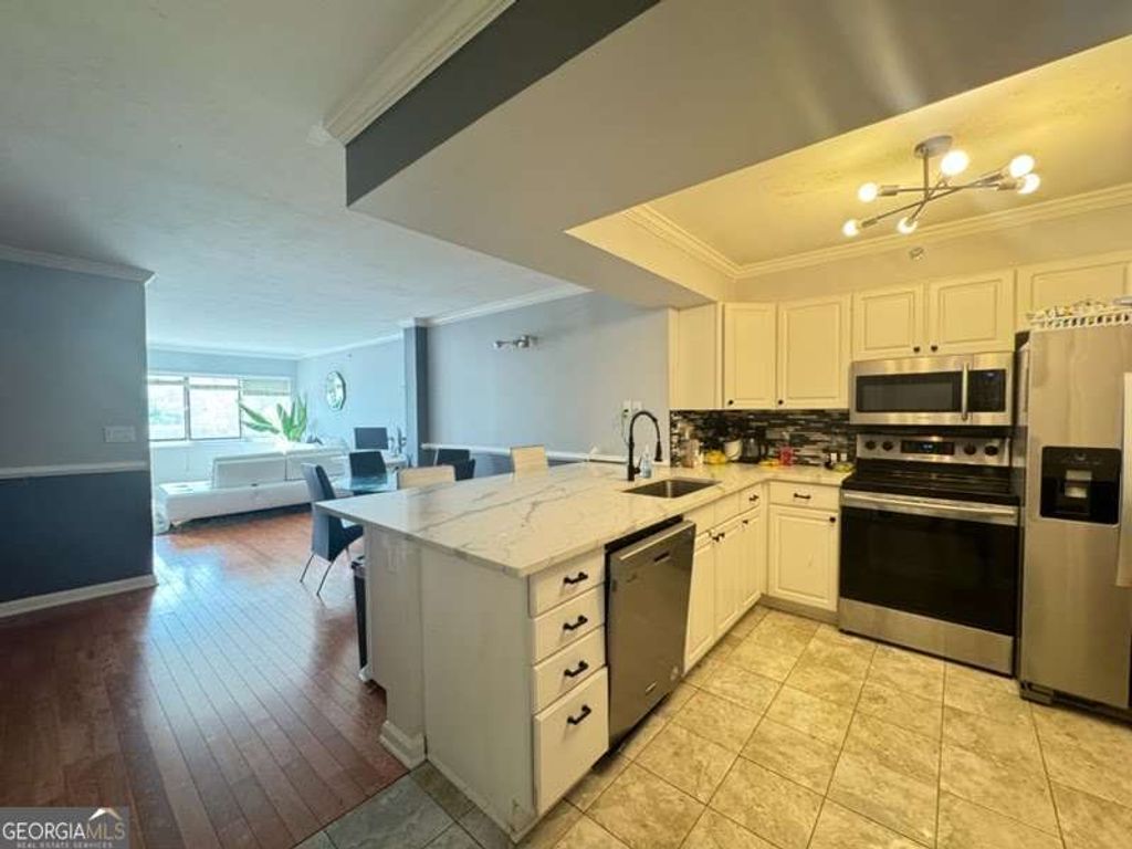 Photo of 795 Hammond Drive #406, Atlanta, GA 30328 (MLS # 10758139)
