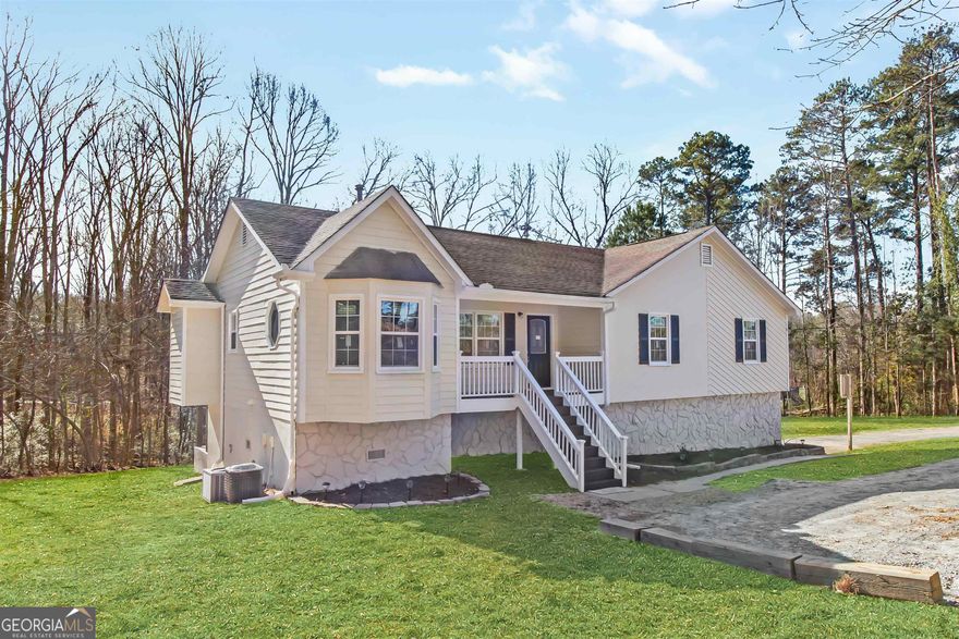 Welcome to this exquisite 6-bedroom, 4-bathroom (can be 5 BR up/ 3 BR down)  raised ranch nestled on a sprawling, private lot in the heart of Douglasville. This meticulously renovated home offers unparalleled comfort, space, and privacy, making it an idyllic retreat for the discerning homeowner. Key Features include Six Bedrooms, Four Bathrooms: Ample living space for the entire family and guests, with versatile rooms suitable for office, gym, media room, fun room or leisure areas. Fully Renovated with no no detail spared in the renovation process, boasting modern finishes, updated fixtures, and top-of-the-line appliances throughout. Situated on over an acre of beautiful land, providing ample room for outdoor activities, gardening, or potential expansion. The property features a level lot, perfect for ease of access and offering a long driveway for multiple vehicle parking. Surrounded by nature and mature trees, offering a tranquil and secluded ambiance, ideal for peaceful living and entertaining. Step inside to discover a thoughtfully designed interior flooded with natural light. The open-concept layout seamlessly connects the living, dining, and kitchen areas, creating an inviting space for everyday living and hosting gatherings. The kitchen is a chef's delight, featuring modern appliances, sleek countertops, and ample storage space. All bedrooms offer flexibility for various needs, ensuring comfort and privacy for everyone in the household. Outside, the property delights with its sprawling yard, providing endless opportunities for outdoor enjoyment and relaxation. Whether it's hosting an event on the patio, creating a garden retreat, or simply basking in the tranquility of nature, this home offers it all. Conveniently located in Douglasville, this property offers the perfect blend of privacy and accessibility. Enjoy the peace and quiet of a rural setting while remaining just a short drive away from local amenities, schools, shopping centers, and major transportation routes. Don't miss the chance to make this exceptional raised ranch your new home. Experience comfort, luxury, and serenity in this fully renovated retreat on over an acre of land. Schedule your private tour today and envision the lifestyle that awaits in this Douglasville gem! Living the country life while in the city!