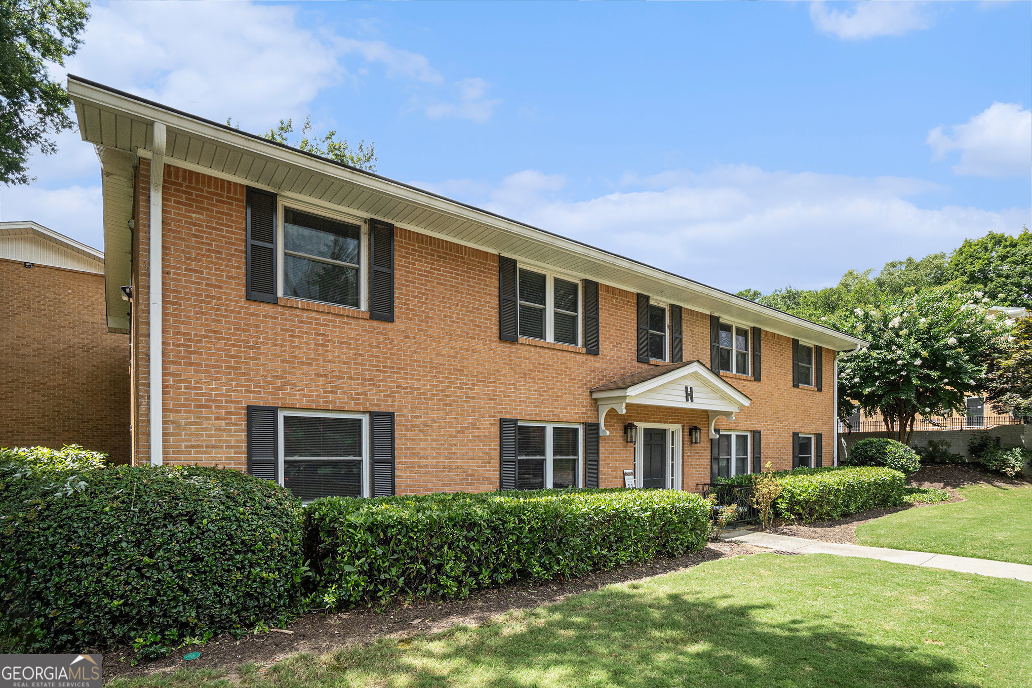 Get ready to call this house your next home or investment property! Affordable living right in the heart of Buckhead. This 1st floor, end unit condo has been well maintained by the seller. The floorplan is open between the family room and dining room. Hardwood and tile run throughout the unit accompanied by natural paint on the walls. The kitchen has been renovated in recent years with updated flooring, cabinets, and stone counters. Both bathrooms have been updated as well. The television, stainless steel kitchen appliances, and laundry appliances will stay with the home. The affordable HOA fee includes pool access and water for the unit. Minutes from Shops of Buckhead, Buckhead Village, MARTA, GA-400, and all Buckhead and Atlanta have to offer. Get your offer in today!