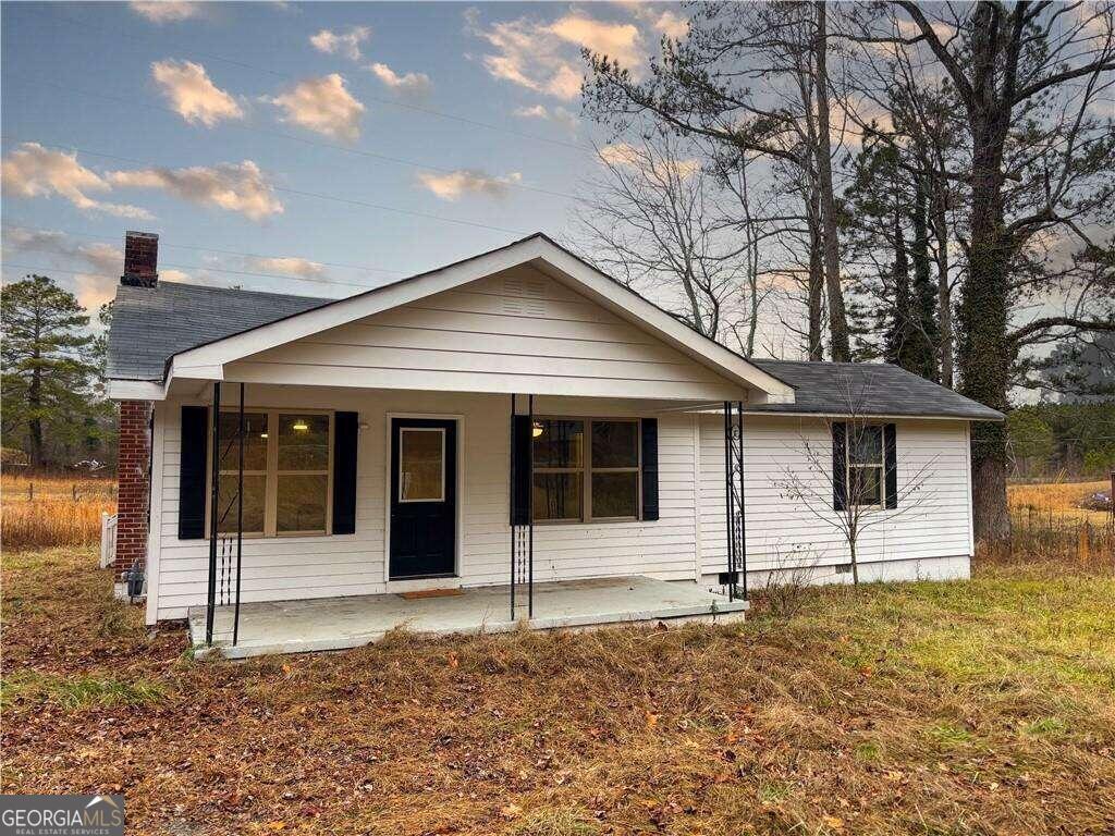 MOTIVATED SELLER! Welcome to your new home in the serene embrace of a country setting! This newly renovated residence seamlessly blends modern elegance with rustic charm, offering a tranquil escape from the hustle and bustle of city life. Step into the new kitchen that boasts of granite countertops and a farmhouse sink. The heart of this home is designed for both functionality and style. Experience the warmth of hardwood flooring that graces the living spaces, adding a touch of sophistication to every step. The resilient vinyl flooring in select areas ensures easy maintenance while maintaining a seamless flow throughout the home. Situated on a large, level lot, the property invites you to bask in the beauty of nature. Whether it's a morning coffee on the porch or an evening barbecue in the backyard, the possibilities for outdoor enjoyment are endless. This home offers a blend of modern amenities and country living. Don't miss the chance to make this home yours.