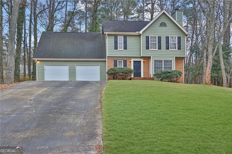 Make a great deal even better with Massive savings through special loan programs with the Preferred Lender Envoy Mortgage with Aubrey Wilcox! Ask the Listing Team for the introduction for up to 100% Financing or even interest rates in the 4s! Nestled on an expansive lot, this traditional 4-bedroom, 2.5-bath home offers the perfect blend of space, comfort, and classic elegance. Step inside to a warm and inviting living room, complete with a bay window and cozy fireplace - the ideal spot for relaxing evenings. The kitchen boasts rich stained cabinetry, a pantry, and generous countertop space, making meal prep effortless. Upstairs, the oversized primary suite is a retreat of its own, featuring an ensuite with dual vanities, a garden tub, and a separate shower. Three additional bedrooms share a well-appointed second full bath, and provide ample space for family or guests. Outside, the expansive yard offers endless possibilities for outdoor activities, gardening, or simply enjoying the fresh air. The back deck is perfect for grilling and entertaining, making every gathering memorable. Enjoy optional access to the swim/tennis amenities of neighboring community WalkerCOs Ridge. Conveniently located just minutes from Marietta Square, Kennesaw Mountain's scenic trails, and sought after Hillgrove School District.