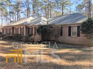 Beautiful and spacious, this 3 large bedroom/ 2 bath Ranch home sitting on over 12 acres will WOW you! 2 fireplaces! Attic space awaits your imagination as it has high ceiling/floored expansiveness. The basement level is ready for drywall adding much more than the 2022 sq ft of already finished space. You will be impressed by the rare layout and finishes this home built 1988 provides. The kitchen boasts gorgeous oak cabinets and an island that any cook would love along with a bricked arch above the cooktop! Screened porch overlooks the backyard full of mature hardwoods. Call today for your showing!