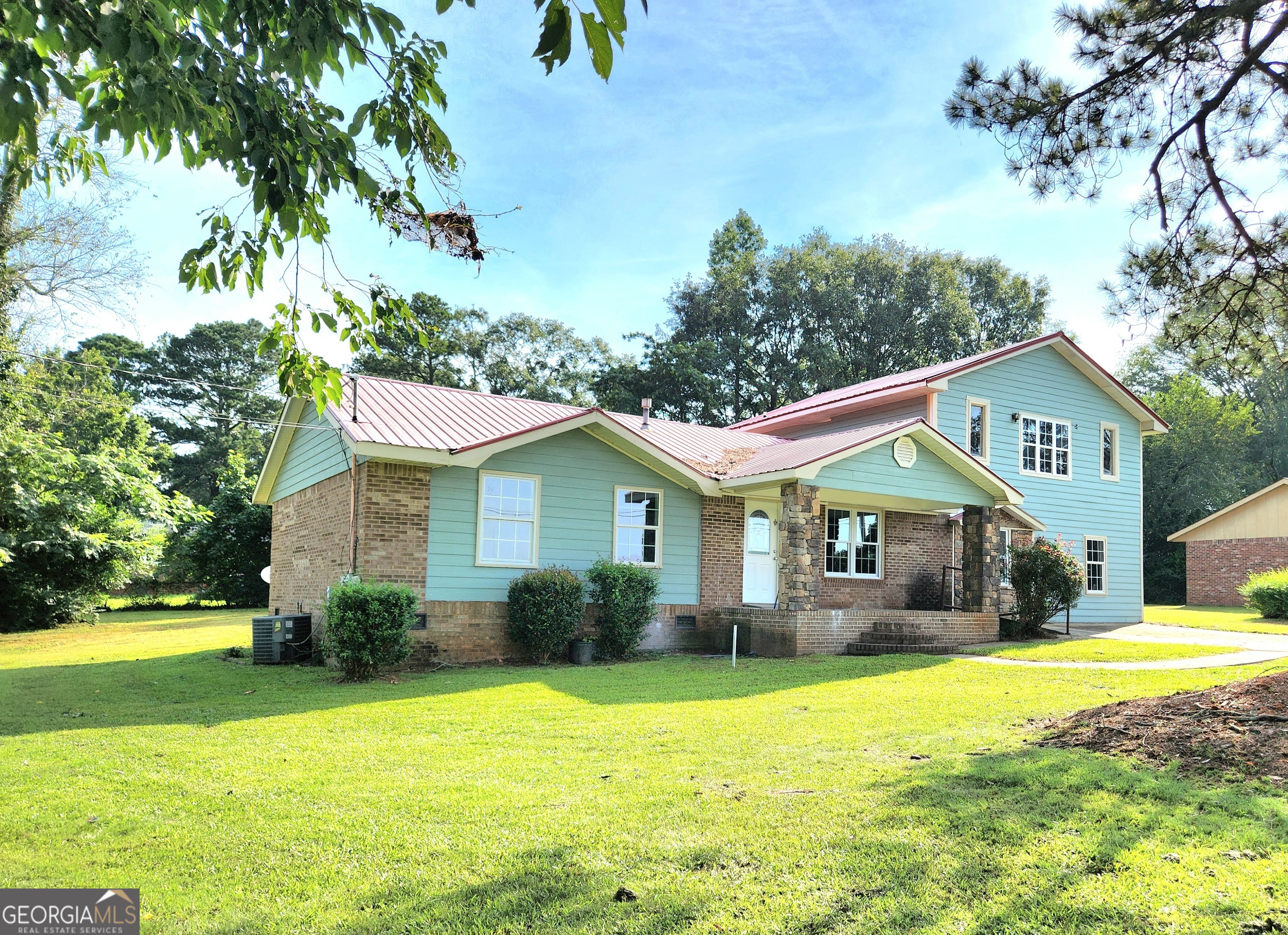 Welcome to this absolutely beautiful 4 bedroom, 2.5 bath home!!! This newly renovated home is located minutes from downtown Greensboro, I-20 and Lake Oconee. The home features 2 master suites, one on the main level and another one on upstairs. The upstairs master suite has a beautiful stone fireplace. The home features a family room, great room, loft area, and dining room. The 2 full bathrooms have tiled showers/tubs, new vanities, and newly installed tile floors. The kitchen has been totally remodeled, featuring new L-Shaped cabinets and quarts countertops. The wood floors have been sanded and stained to bring out it's beautiful color. This home sits on a beautiful 0.38 acre corner lot. Don't miss out on this gem! Call today to schedule an appointment to tour.