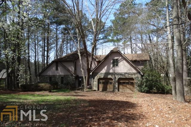 Spacious 1.5 Story Home on Lake. Private Dock w/Covered Boat Slip. Very Unique Floor plan. There is a 2sty Entry Foyer, Sunken Great Rm W/Vaulted Ceiling, Fireplace and Skylights, Country Kitchen, Half bath, Laundry Room, Master bedroom w/Private Deck, Full Bath w/Dual Vanity, Jetted tub, Sep. Shower and WIC. Upstairs there is a 2nd Master bedroom w/Sitting Rm and Full Private bath, 2 more secondary bedrooms and a Full Hall bath. There is a Sun room on the rear overlooking the lake. There are multiple skylights thru out home. See Private Remarks for special instructions