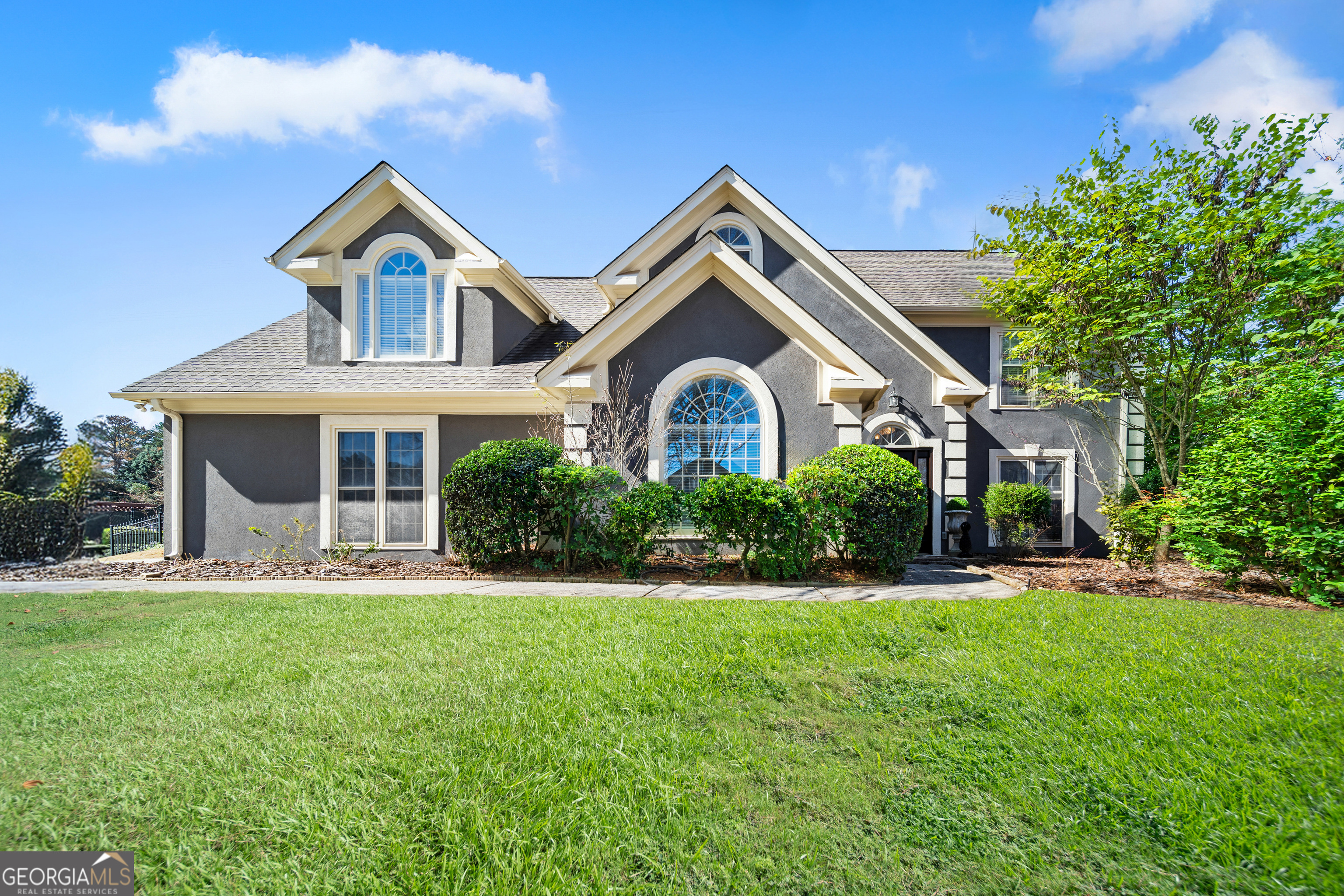Welcome to your new home in the heart of East Cobb, tucked inside the top-rated Walton High School district. This thoughtfully updated home is move-in ready and filled with upgrades that make everyday living easy and enjoyable. Recent updates include a brand-new roof and gutters, freshly painted inside and out, a Wi-Fi-enabled garage system, new double-paned windows, and even a freshly epoxied garage floor. The landscaping has been beautifully maintained, giving the home great curb appeal from the start. The backyard feels like your own private getaway with a calming waterfall and Koi pond, charming trellis arch, and a pergola strung with cafe lights making the backyard perfect for family gatherings or relaxing evenings outdoors. Step inside to a two-story foyer with a stunning chandelier imported from Germany. The kitchen has been completely renovated with high-end appliances and plenty of space for cooking and connecting, lit by a gorgeous Italian chandelier that matches the one in the dining room. Upstairs, you'll find four comfortable bedrooms, including a spacious master suite with a cozy sitting area and vaulted ceilings. Updated bathrooms and new hardwood floors throughout the upstairs add an extra touch of warmth and style. This home is part of a friendly swim and ALTA tennis neighborhood, and you'll love being so close to shops, restaurants, major highways, and the beautiful walking trails at the Chattahoochee National Recreation Area.