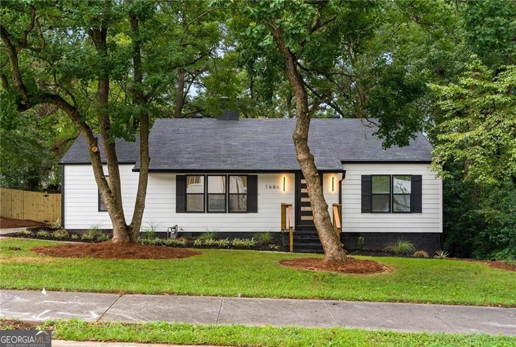 Fantastic opportunity for a beautifully renovated 3-bedroom, 2-bathroom ranch paired with not one, but two accessory dwelling units (ADUs), offering unmatched flexibility and value. Whether you're looking to enjoy multi-generational living, host guests, or offset your mortgage with rental income, this property checks all the boxes. The main residence features an open-concept layout bathed in natural light, with stylish flooring and tasteful updates throughout. The updated kitchen boasts quartz countertops, stainless steel appliances, and abundant cabinetry, flowing effortlessly into the separate dining area space perfect for entertaining. The spacious primary suite includes a private en suite bath, while two additional bedrooms and a full bath offer plenty of space for family or a home office. Outside, you'll find a spacious, fenced backyard, ideal for outdoor living and play, plus a newly poured driveway offering ample off-street parking. What truly sets this property apart are the two independent ADUs. One is a turnkey guest house-ideal for family, visiting friends, or even a private home office. The other comes tenant-occupied, providing reliable monthly income from day one. Whether you're looking to "house hack" or simply enjoy the versatility of additional space, this setup adapts to your lifestyle. Conveniently located just minutes from Perkerson Park, neighborhood dining, and vibrant local shops. Don't miss this rare opportunity to own a home that offers comfort, flexibility, and built-in financial upside in one of Atlanta's most up-and-coming neighborhoods.
