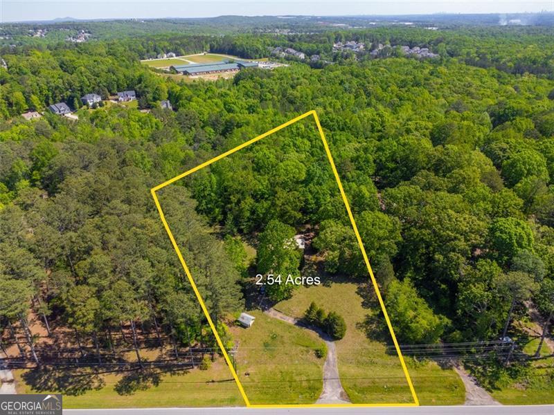 2 lots for the price of one! 3800 Fairburn rd, and 3806 Fairburn rd. 3 acres total. Land has already been approved for rezoning: Residential Medium Density. Approved for up to 8 residential homes. Or teardown and build your dream home. Easy access from the street via driveway. There is already a home on the land.