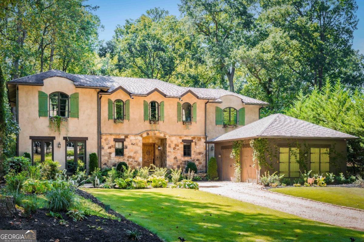 Welcome to this one-of-a-kind, Tuscan-Inspired Chateau in Prestigious Pine Hills/Brookhaven! Nestled on a quiet, tree-lined street in one of Buckhead's most desirable neighborhoods, this breathtaking European chateau offers a rare blend of European countryside elegance and modern luxury in the shadows of downtown Buckhead. Boasting five spacious bedrooms, four and a half baths, and a fully finished basement, this custom estate was built for refined living and effortless entertaining. From the arched doorways and hand-picked details to the wrought iron accents and warm stone finishes, every detail evokes the charm of an Old World villa-while embracing the sophistication of a modern Atlanta lifestyle. The gourmet chef's kitchen is the heart of the home, featuring premium appliances, a large central island, and seamless flow into both living and dining spaces. French doors open onto a private, beautiful stone patio-perfect for entertaining under the stars. The oversized primary suite is a true retreat, complete with a spa-like bath, custom walk-in his/her closets, and serene views of the grounds. Additional bedrooms are generously sized and thoughtfully designed for comfort and privacy. Downstairs, the fully finished basement offers a world of possibilities-including a custom home theater, office, home gym, wine cellar, and/or in-law suite. The large garage doors offer you wide open access to the large flat backyard, perfect for a future pool. This remarkable residence is one you have to see to believe, the perfect combination of peaceful vineyard-style living with the convenience of everything to love about living in the city-just minutes from Buckhead's top schools, shopping, dining, and parks.