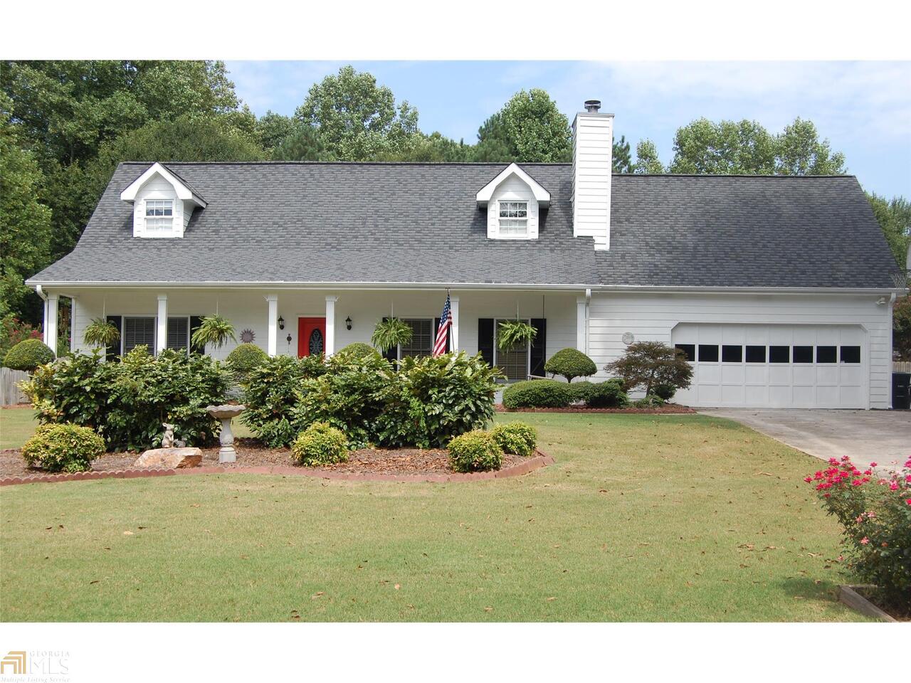 SEEING IS BELIEVING! Huge Immaculate 4 Bedroom/2.5 Bath! MASTER ON MAIN! Large Kitchen/tons of Cabinets and Built in Desk! Spacious Eat In Area! Hardwood Floors! Formal Dining/seating 12+! Built In Shelving in Great Room!! Beautiful Master Suite and Master Bath with Whirlpool Bath/Walk In Closet/Sep Shower and Double Vanities! Master On Main! 2 Separate Stairways to get upstairs! 3 Large Secondary Bedrooms Up with Full Bath! Huge Detached finished Building and Workshop (Great for Rec Room, In Law Suite or Workshop) LARGE/LEVEL Fenced in Yard/Private! Patio is Perfect for Entertaining! This Home is VERY WELL MAINTAINED! Professionally Landscaped! Wonderful Quiet Subdivision! Optional Swim/Tennis! Won't Last Long! Easy to SHOW! Call Me!