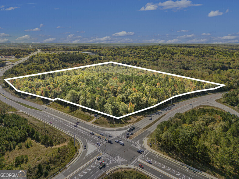Offering a prime business location with high visibility and easy accessibility. Situated along GA-92, a major thoroughfare connecting Hiram to Douglasville, this property benefits from significant traffic flow, ensuring excellent exposure for any business. The site is near key intersections, including Bill Carruth Parkway S and Hiram Douglasville Highway, making it easily accessible from multiple directions. The surrounding area is a growing commercial hub with a mix of retail, dining, and service businesses, attracting both local residents and commuters. This strategic location provides ample opportunities for businesses looking to capitalize on the area's expanding economy and increasing population. Introducing a prime investment opportunity in Hiram, GA! This 39.4 Ac lot presents an attractive prospect for Land and Other Investors. Situated on the bustling Hiram Douglasville Highway, this property offers excellent visibility and access. The building's versatile layout and strategic location make it ideal for a range of potential uses. Seize the chance to capitalize on the dynamic Hiram market with this standout property. - 39.4 Ac building lot in prime Hiram location - Excellent visibility on Hiram Douglasville Highway - Versatile layout suitable for various potential uses - Strategic location for maximum investment potential - Opportunity to capitalize on the dynamic Hiram market