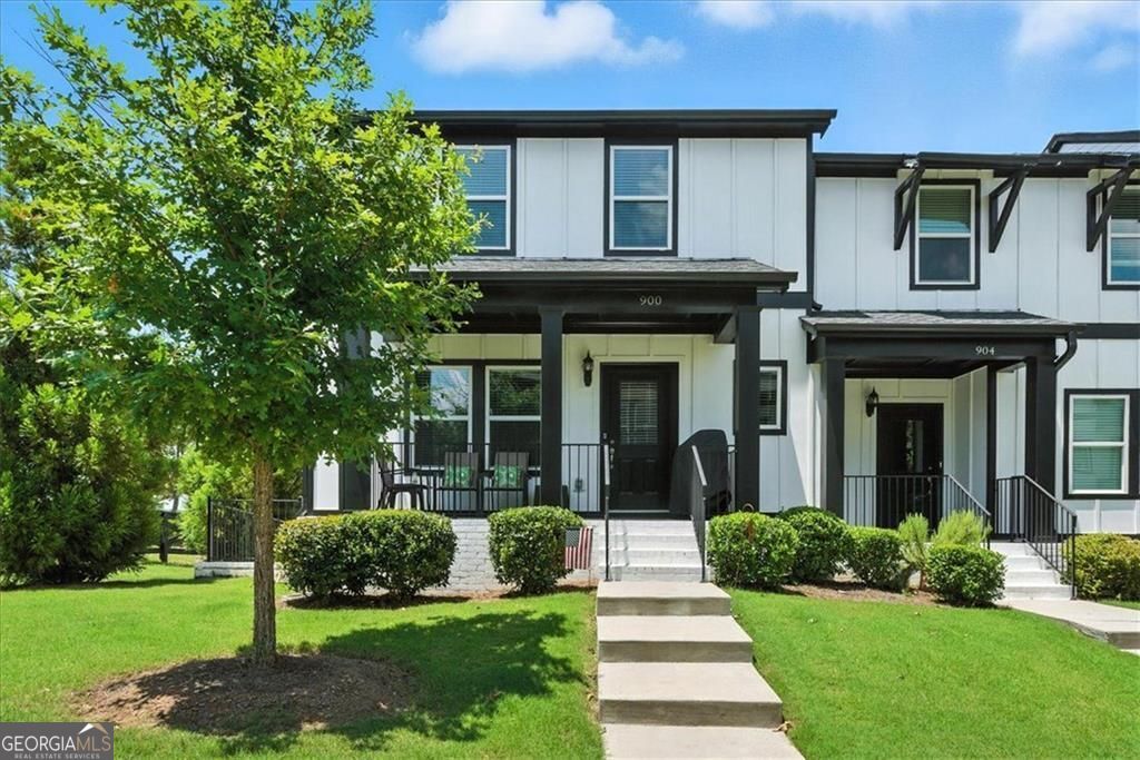 Welcome to a captivating property with the perfect blend of charm, elegance, and modern comfort. 900 Sweetwater Grove is a sought-after end unit, providing abundant natural light, privacy, and lovely views. Step inside from the quaint front porch into the main level. Here you'll find a beautifully appointed kitchen featuring all stainless-steel appliances, double ovens, tile backsplash, and modern light fixtures. This kitchen is not only functional but also aesthetically pleasing. The generous island serves as a focal point and encourages casual dining, whereas the adjoining dining area is perfect for hosting dinner parties or family gatherings. This level also boasts an open-concept great room, a walk-in pantry, a large hall closet, and a convenient half-bath. Upstairs, you'll find the luxurious, oversized primary bedroom featuring an ensuite bath and two spacious walk-in closets. This level also offers a conveniently located laundry closet with washer and dryer, plus two additional bedrooms that share a well-appointed full bath-perfect for family or guests. The flat driveway leads you to the basement level, where a two-car garage provides ample parking and extra storage space. This level also includes a generously sized bedroom, a full bathroom, and a welcoming foyer. More than just a house, this exquisite residence is a place to truly call home-a space where memories are made and everyday life is embraced with ease and comfort. Come experience the perfect blend of refined living and local convenience. This townhome has it all!