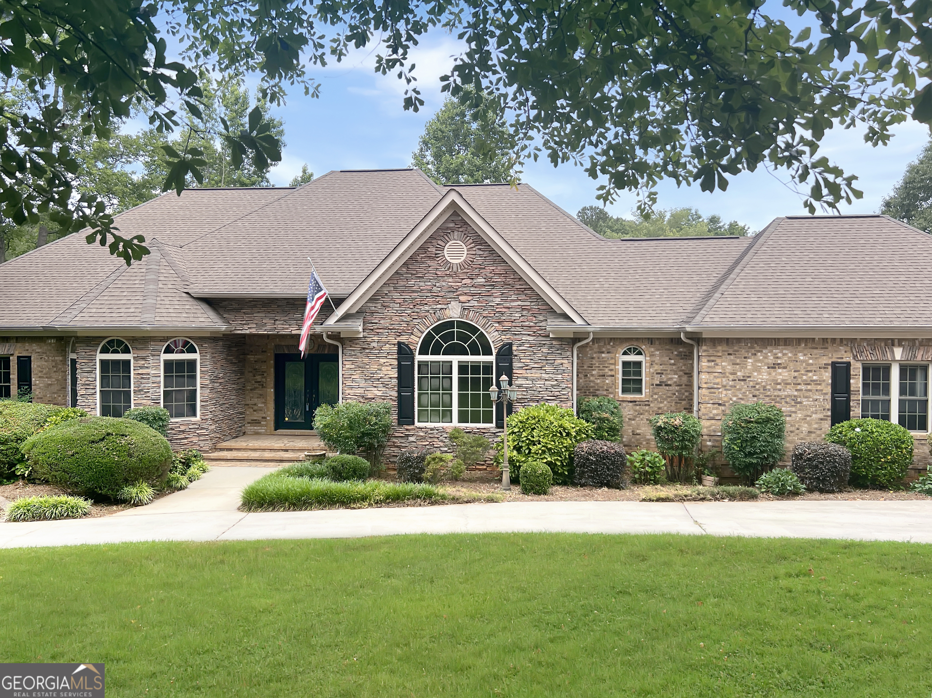 -Stunning 5-Bedroom 5200 Sq Ft +/- Brick Ranch on 1.25 ac homesite with fresh paint throughout and brand-new flooring. -Grand Circular Driveway leads to a thoughtfully designed interior. -Spacious Office with 12-foot ceilings, keeping room, and large great room for gatherings. -Formal Dining Room with soaring ceilings, perfect for entertaining. -Owner's Suite Retreat features a private sunroom connecting to the great room. -Fully Finished Terrace Level with 2 additional bedrooms, full bath, kitchen, and dining area. -Expansive Family Room with fireplace and sliding French doors opening to the pool area. -Screened-in porch ideal for relaxing or entertaining. -Seamless Indoor-Outdoor Living with poolside and lakefront access. -Massive 1,000 Sq. Ft. Storage Area in basement with double-door exterior access. Rare Opportunity for lakeside living with modern upgrades and timeless elegance! Schedule your private tour today!