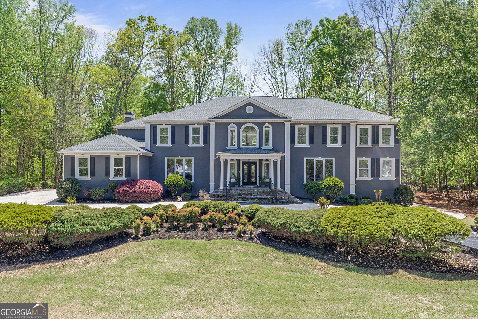 Discover unmatched elegance and sophistication in this stunning estate, nestled within the prestigious gated Whitewater Creek community in Fayetteville, GA. Situated on a beautifully landscaped **1.3-acre lot**, this residence features **7 bedrooms, 7.5 bathrooms**, and every amenity designed for a life of comfort, style, and entertainment. The chef's kitchen is a true masterpiece-custom range hood, built-in wine cooler, professional-grade appliances, three ovens, and a grand island perfect for hosting and gathering. Retreat to the primary suite, a private sanctuary of over 1,500 sq. ft., offering a spa-inspired shower, jacuzzi tub, and dual custom walk-in closets wrapped in marble elegance. Each of the secondary suites is thoughtfully designed with en-suite bathrooms and distinctive custom tile. The fully finished terrace level offers the ultimate entertainment space-complete with a **10-seat theater, home gym, billiards room, custom bar, and second laundry room.** Step outside your door into a community tailored for leisure and recreation. Whitewater Creek offers: Championship 18-hole golf course, Resort-style pool & sundeck, Tennis & pickleball courts, Playground & fitness center, Clubhouse with event space, and Full-time security for peace of mind. This property represents more than just a home-it's a lifestyle. With expansive indoor and outdoor living, world-class community amenities, and timeless luxury at every turn. Don't miss the chance to experience it for yourself-schedule your private showing today.