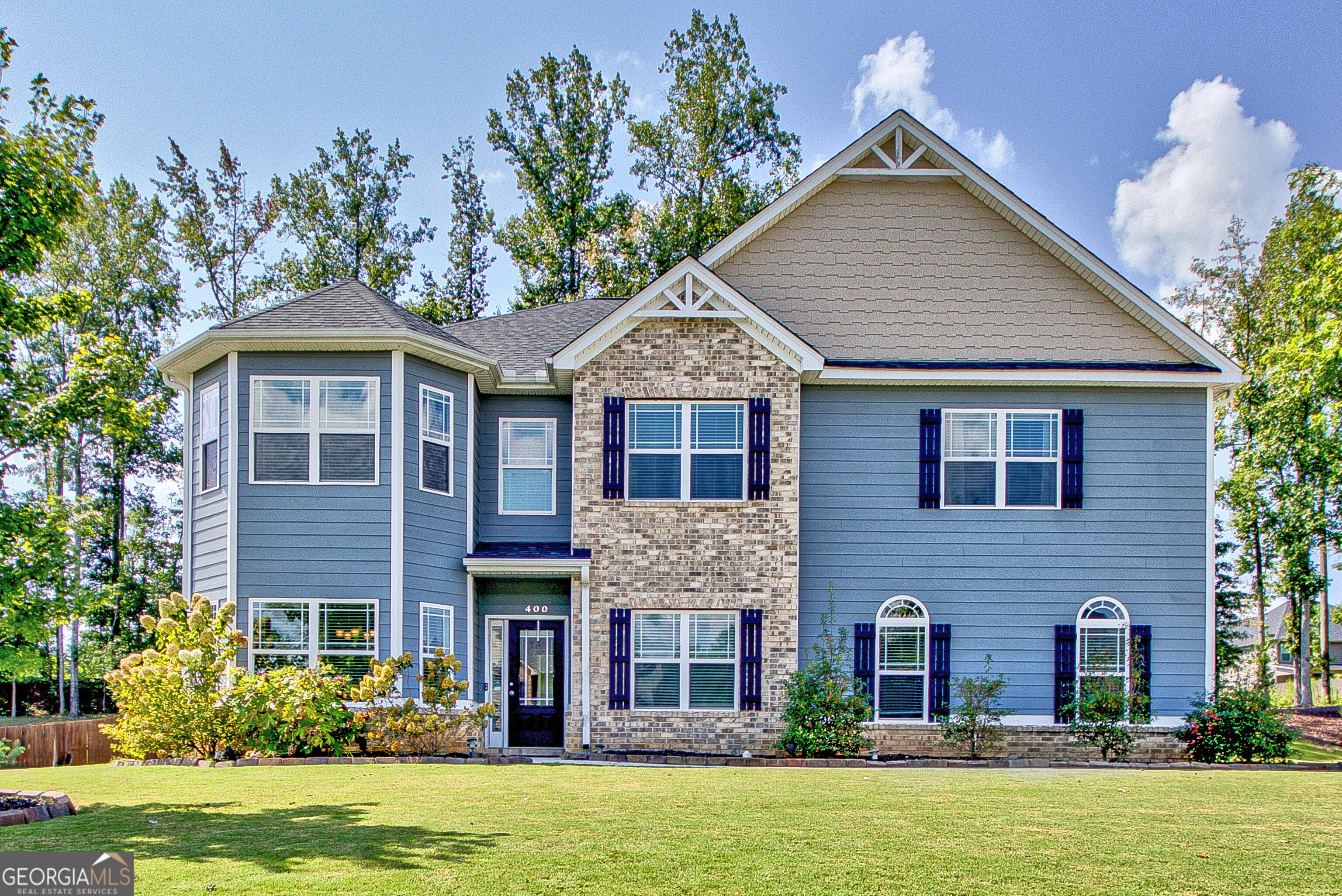 If you've been dreaming of a home with room for everyone (and everything), this one will win you over! From the moment you step inside, the thoughtful floorplan and inviting spaces make it easy to picture everyday life here. The Primary Suite is tucked away on the main level, giving you a private retreat while the heart of the home shines with its open Great Room and bright kitchen-perfect for gathering with family or friends. The kitchen island is where conversations flow, while the abundance of cabinets and even a coffee room make mornings a little sweeter. A mudroom/drop zone keeps the day-to-day organized, and hardwood floors bring warmth throughout the main living spaces. Upstairs is a dream with four bedrooms, each connected by a Jack-and-Jill bath. There's also a rec/TV room for movie nights and a bonus room ready for play, hobbies, exercise or a quiet getaway for you or your guests when they stay. Step outside and enjoy the level backyard, ideal for cookouts, games, or simply unwinding from the covered back porch. And when you're ready for community fun, Heritage Pointe has it all-pool, clubhouse, playground, and tennis courts-plus you're just minutes from both Peachtree City and historic Senoia, where charming shops and restaurants await. This isn't just a house-it's the space, comfort, and lifestyle you've been looking for at a great value!
